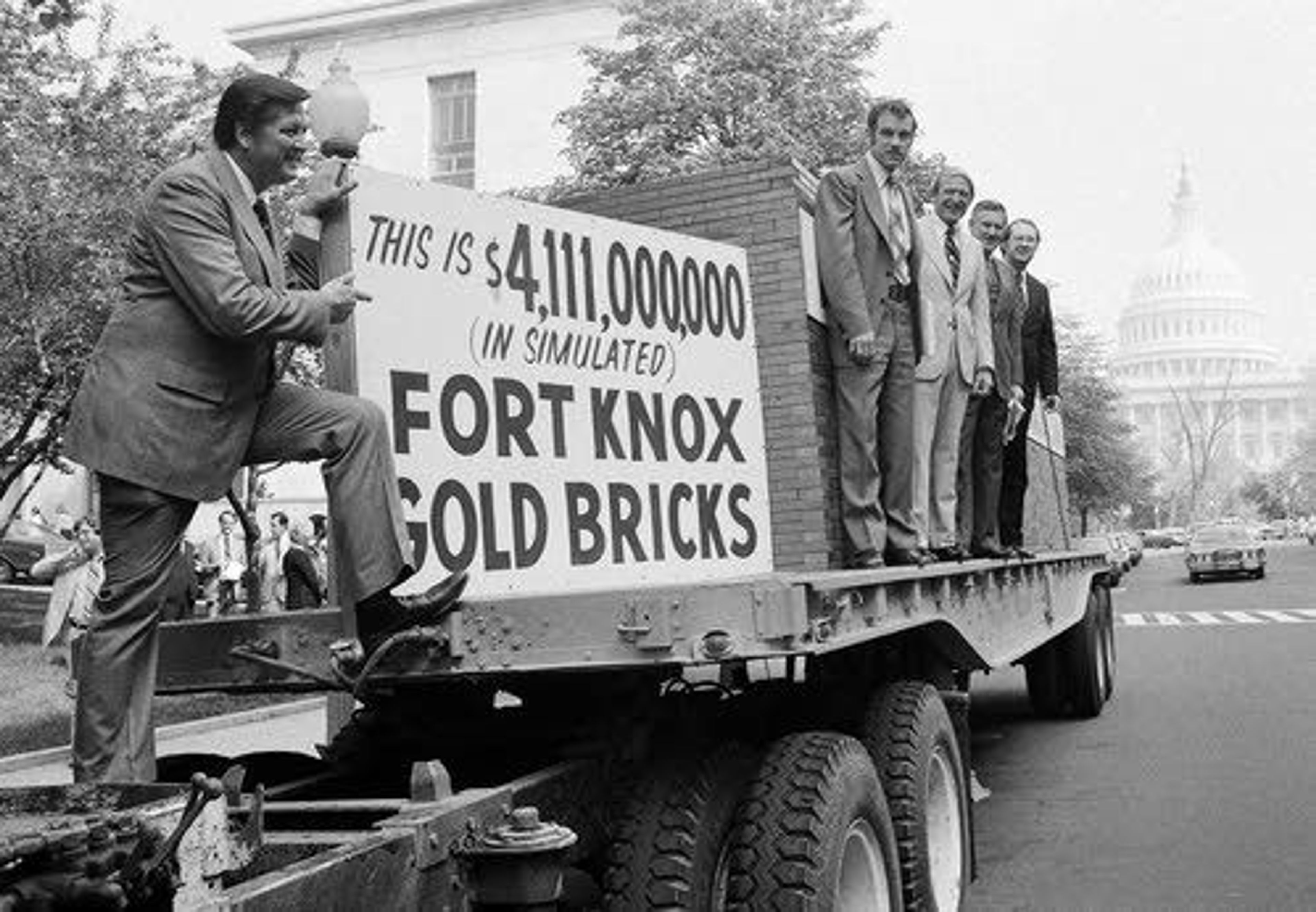 This April 25, 1979, file photo shows Rep. George Hansen (left) and other members of Congress gather around a truck loaded with 44,300 simulated gold bricks to indicate their strong opposition to the estimated $4.1 billion it will cost the U.S. taxpayers to give away the Panama Canal. Hansen, a colorful Idaho politician, died Thursday at 83.