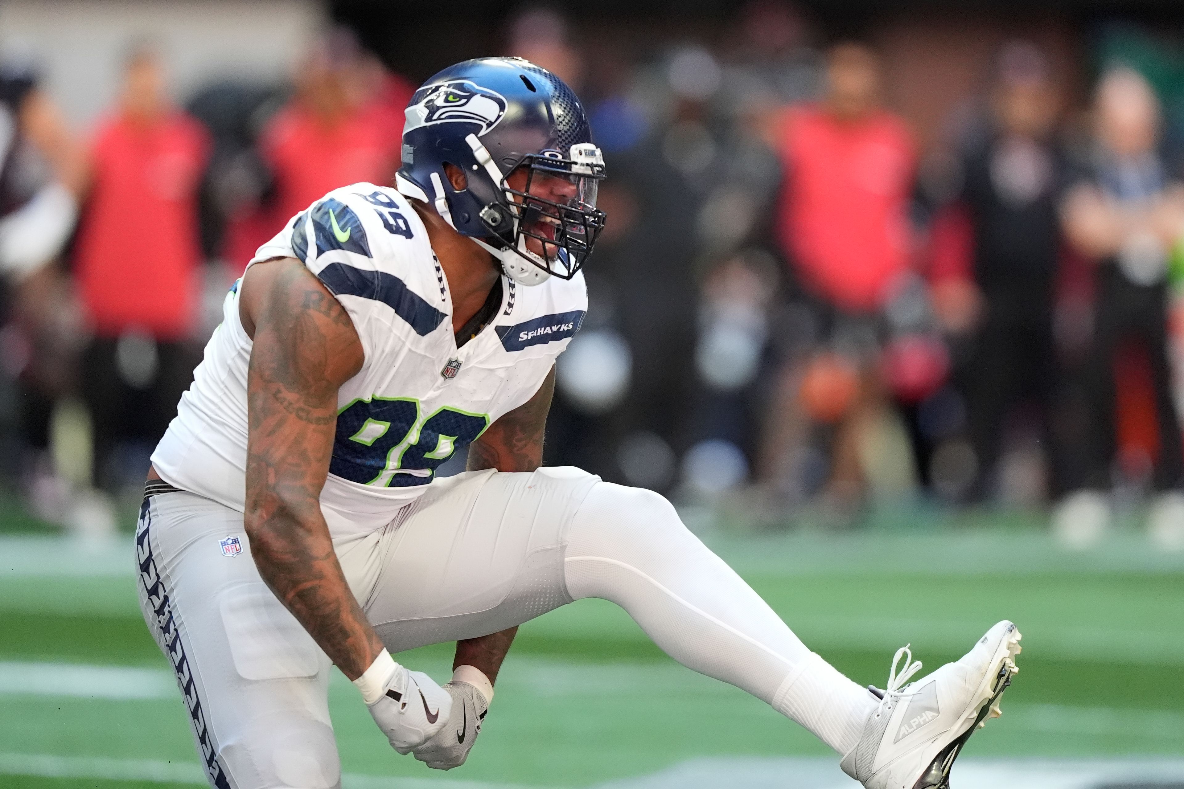 Seattle Seahawks defensive end Leonard Williams (99) reacts after sacking Atlanta Falcons quarterback Kirk Cousins during the first half of an NFL football game, Sunday, Oct. 20, 2024, in Atlanta. (AP Photo/ Brynn Anderson )