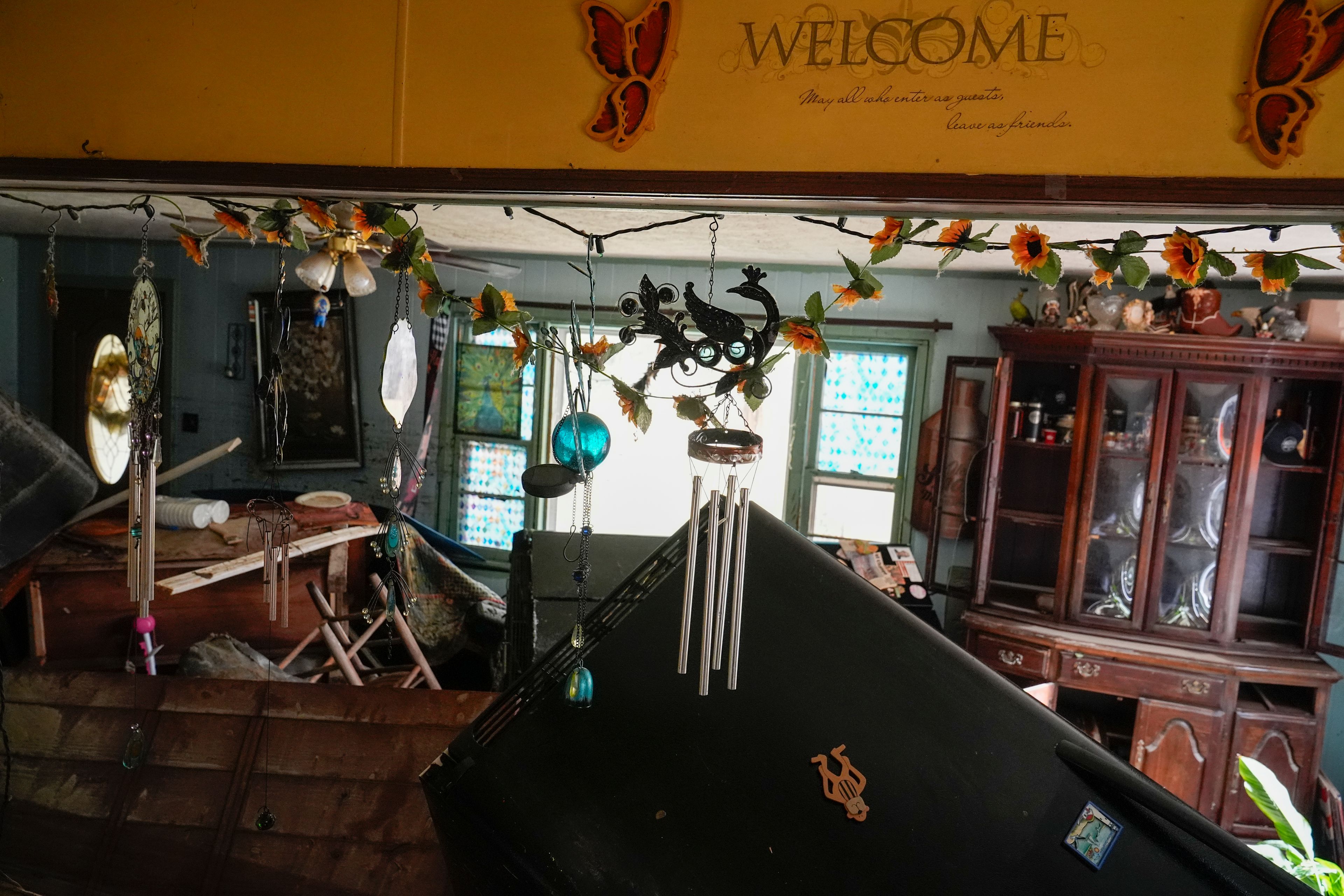 Flood damage is seen inside a home along River Rd., Saturday, Sept. 28, 2024, in Newport, Tenn. (AP Photo/George Walker IV)