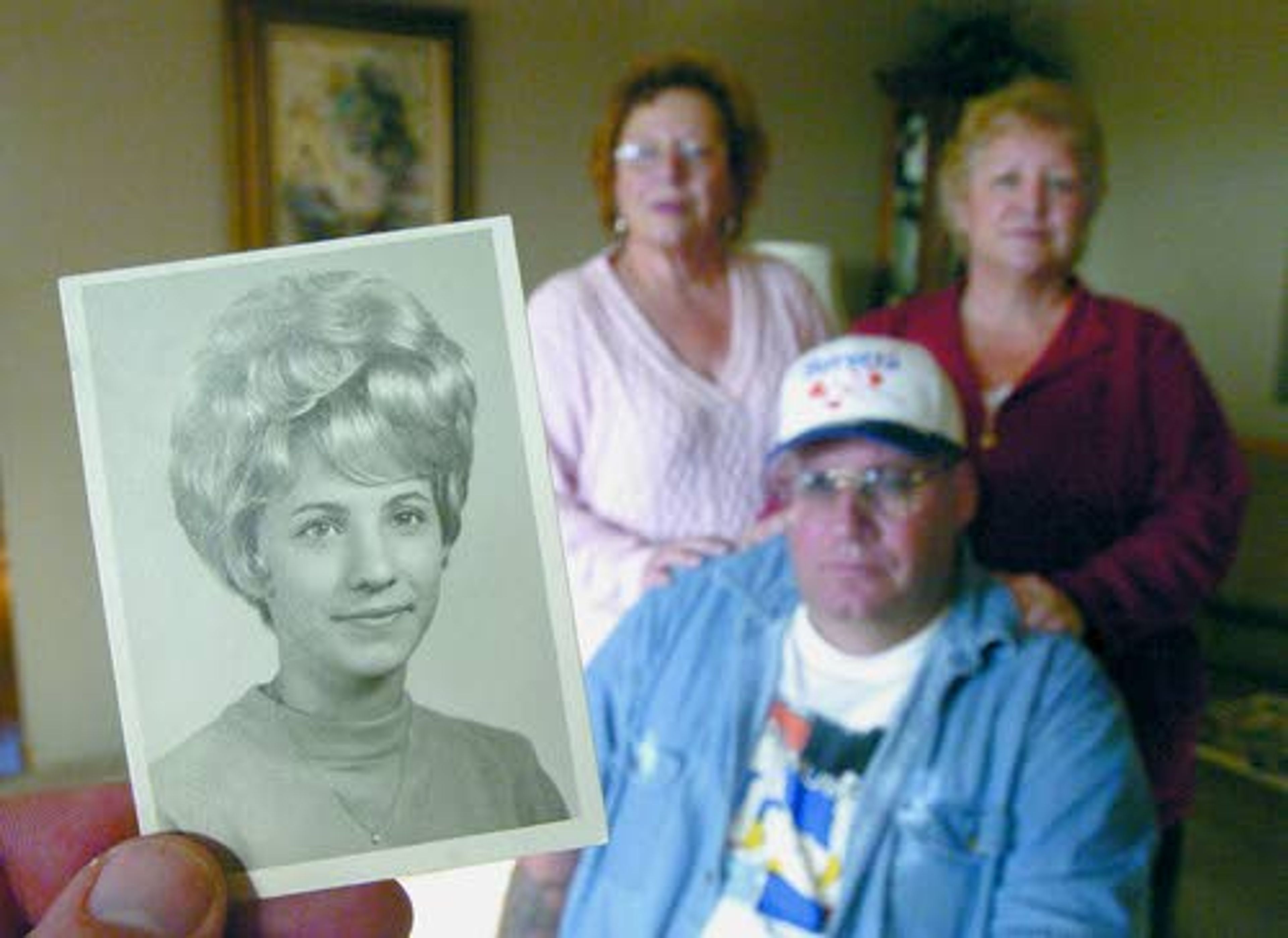 Tribune/Steve hanksPatty Otto’s graduation photo is one of the few keepsakes her three siblings — from left, Vickie Schaffer, Tom O’Malley Jr. and Alice Mills, — have since she disapeared 32 years ago.