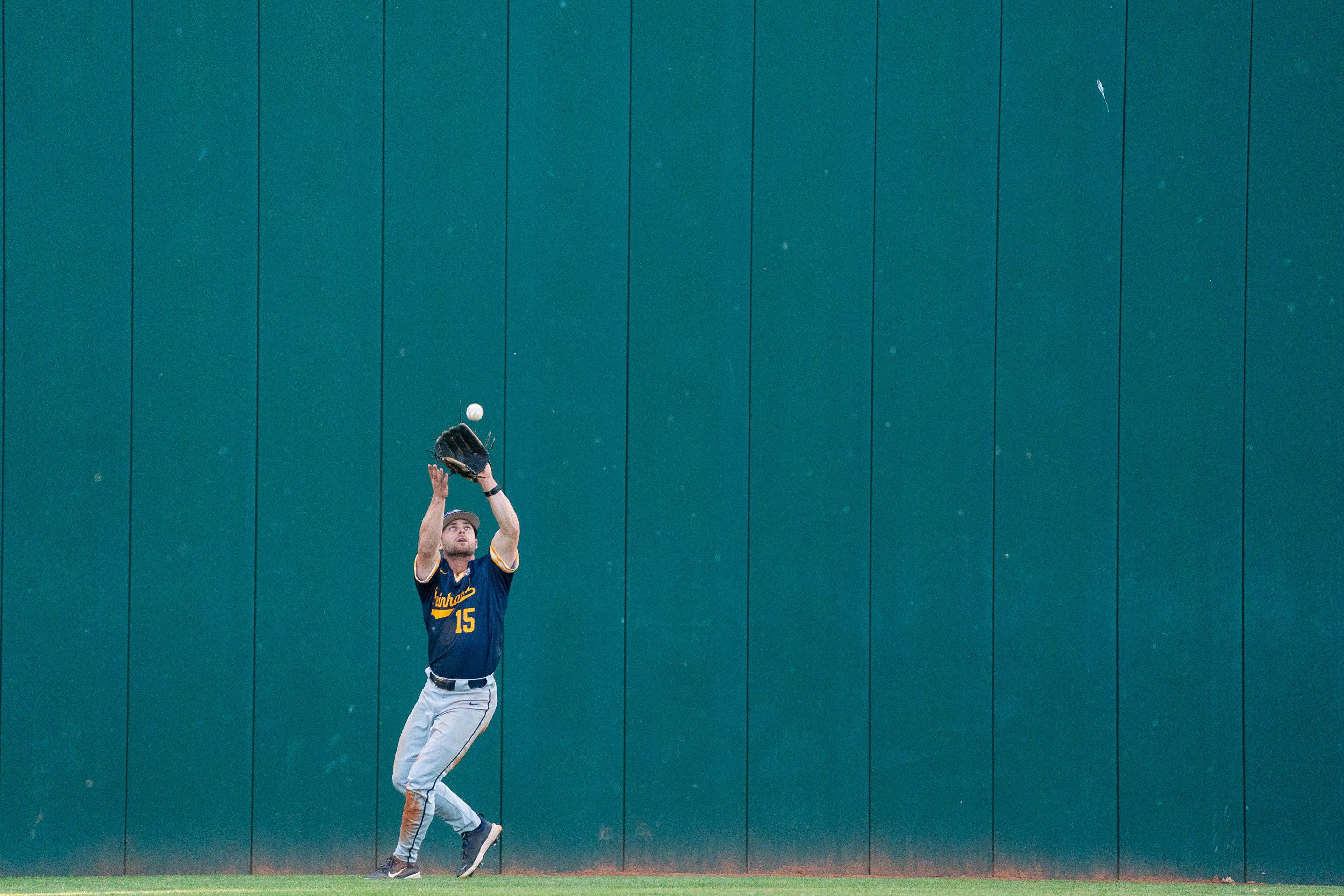 Reinhardt center fielder Lance Dockery catches a fly ball during Game 18 of the NAIA World Series against Tennessee Wesleyan on Thursday at Harris Field in Lewiston.