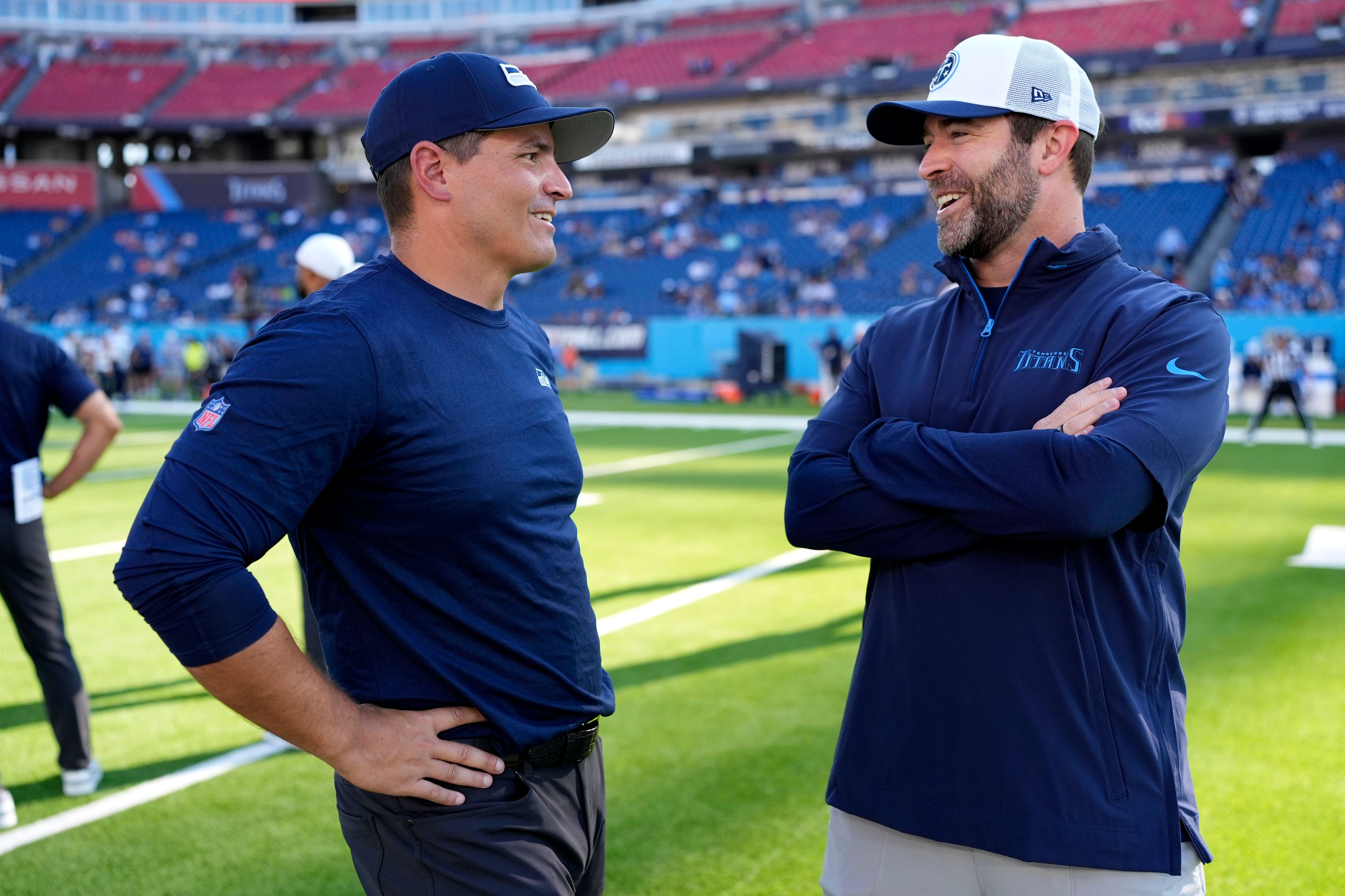 Seattle Seahawks head coach Mike Macdonald, left, talks with Tennessee Titans head coach Brian Callahan before an NFL preseason football game, Saturday, Aug. 17, 2024, in Nashville, Tenn. (AP Photo/George Walker IV)