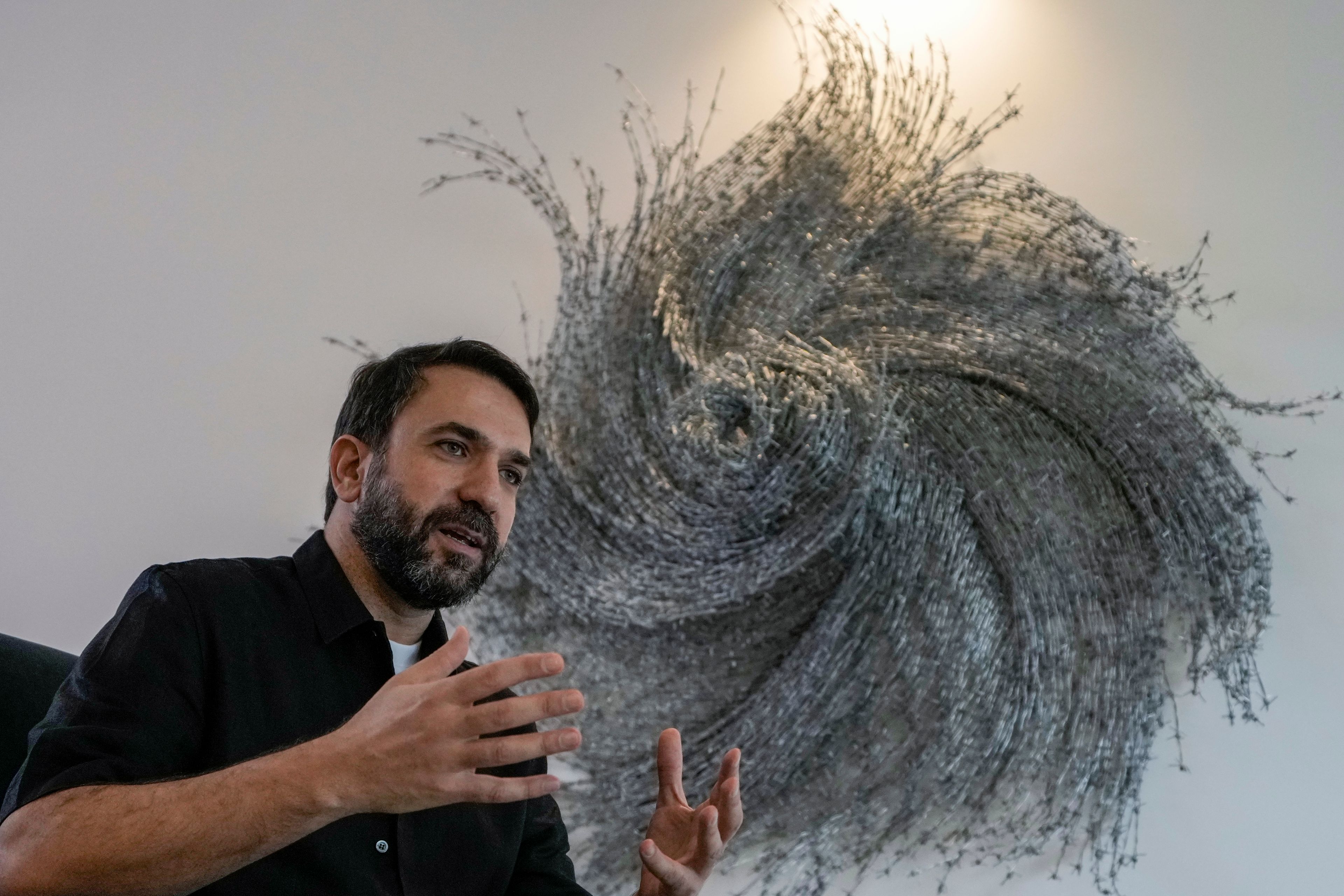 Lubnan Baalbaki speaks during an interview with The Associated Press at his house in Geitawi, Beirut, Lebanon, Thursday, Oct. 31, 2024. (AP Photo/Bilal Hussein)