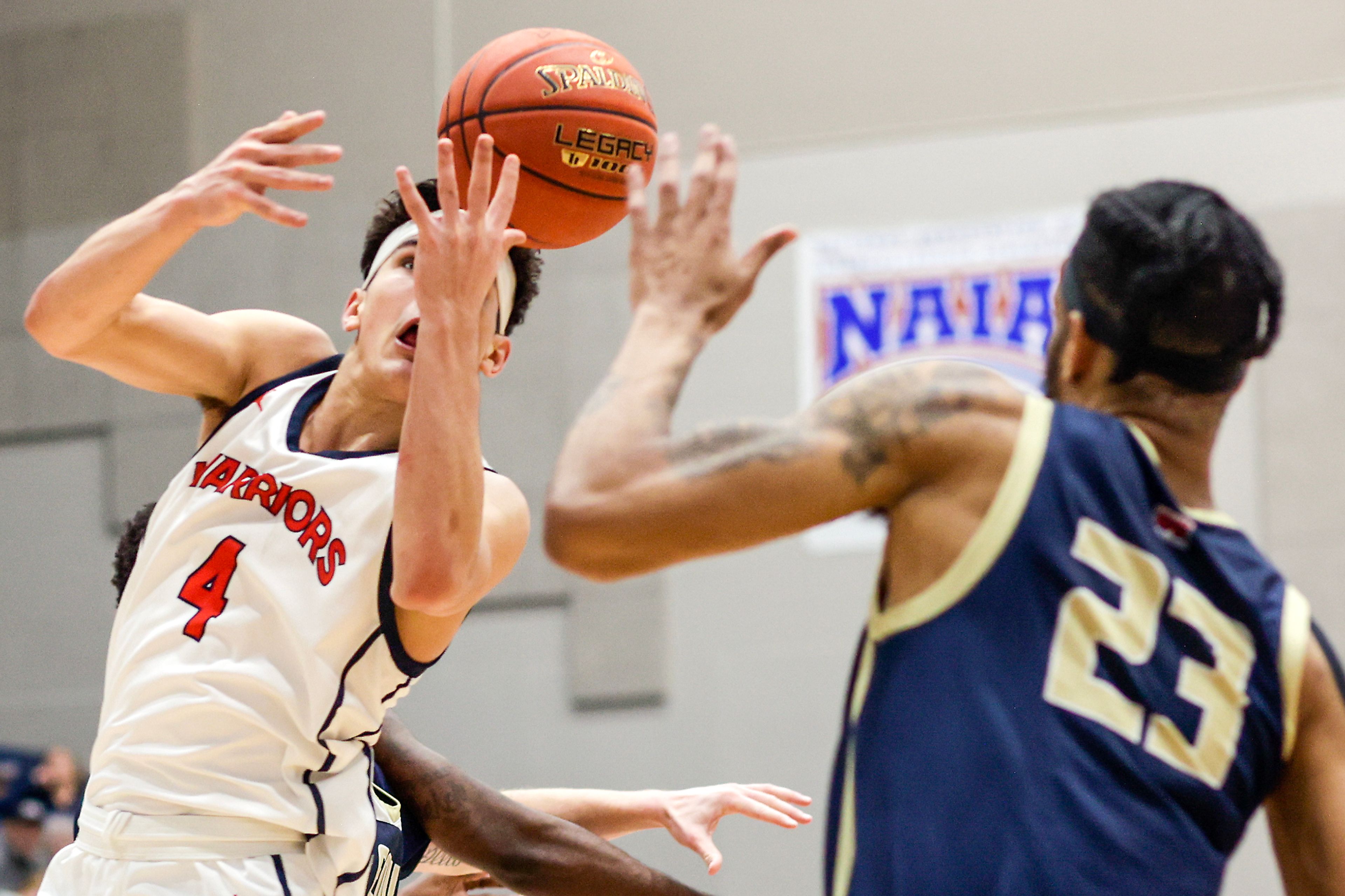 Lewis-Clark State guard Silas Bennion, left, tries to grab the ball during a Cascade Conference game Friday against Eastern Oregon at Lewis-Clark State College.