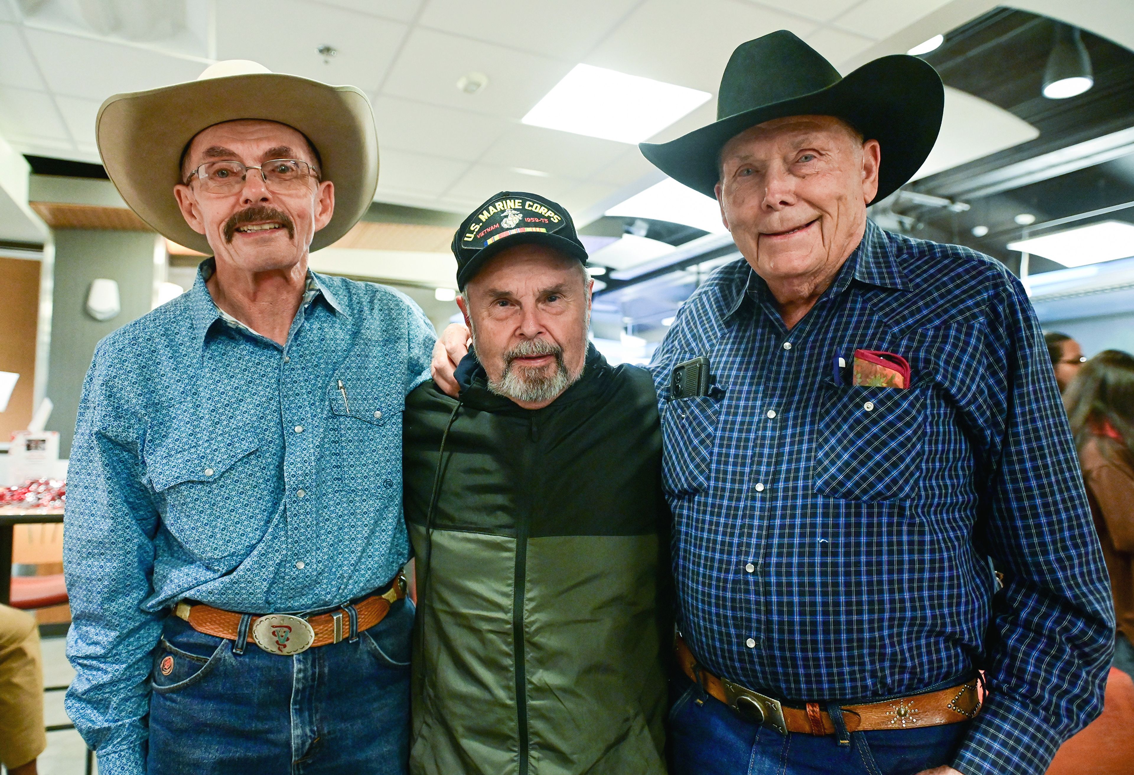 Class of 1974 alumni of the Washington State University College of Veterinary Medicine Tom Williams, left, Cliff Heino, center, and Bob Krieg take part in the 125th anniversary celebration of the school Friday in Pullman.,