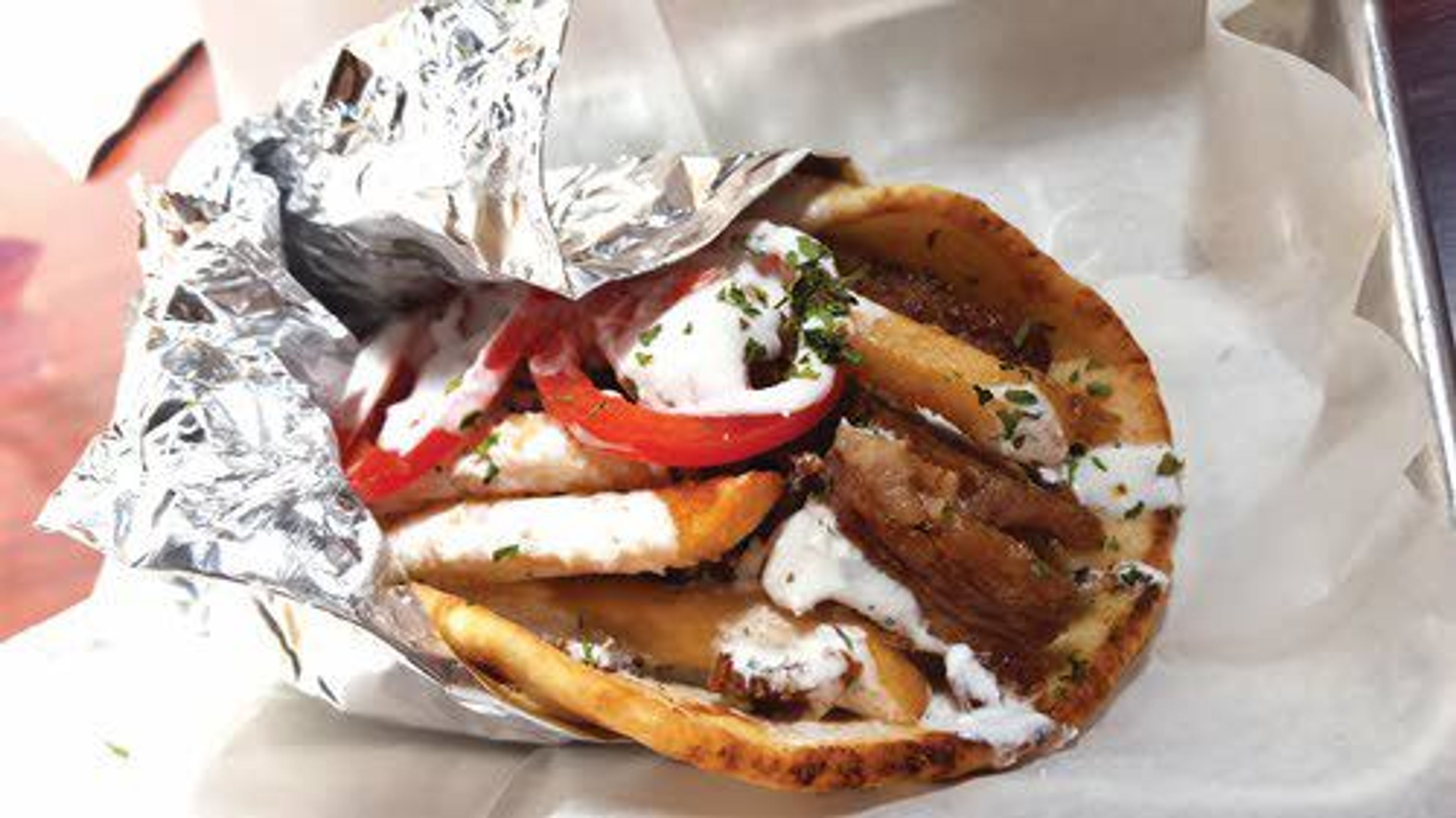 The Gyro Pita with pork comes with fries inside, lathered with tzatziki.