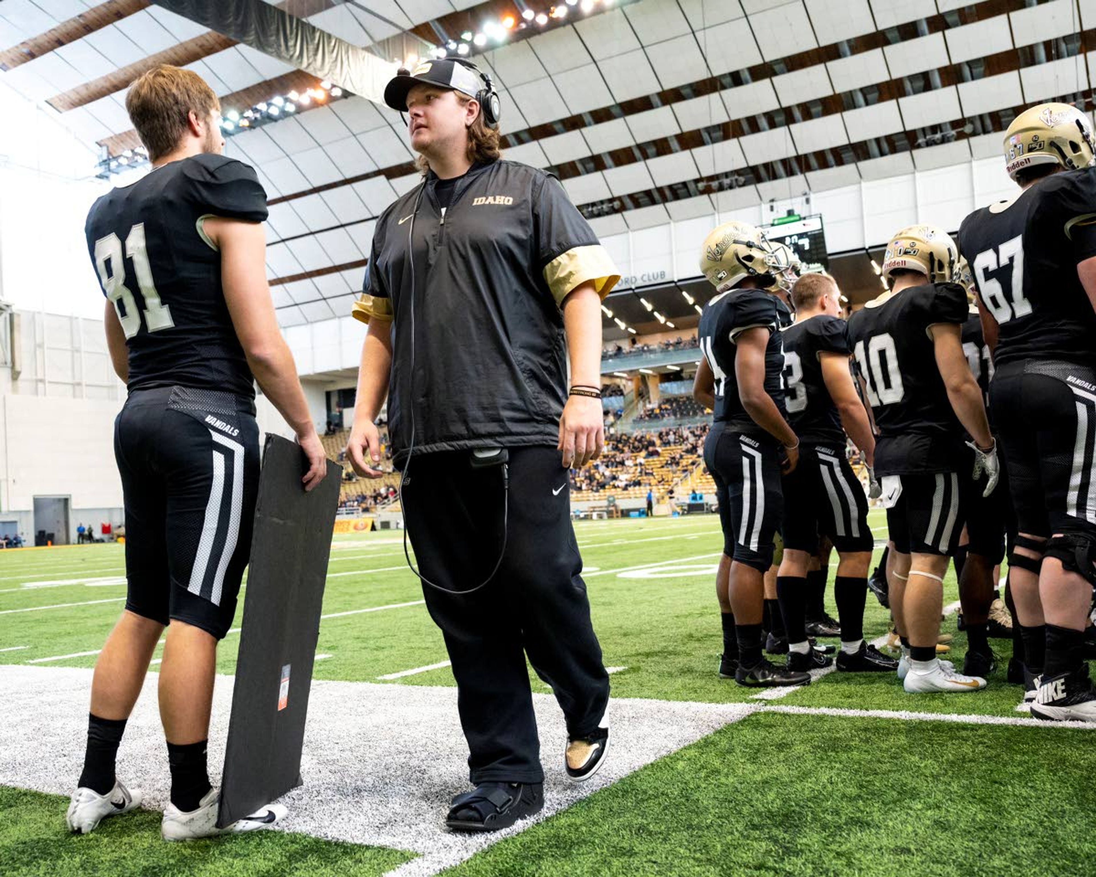 Colton Richardson (center) walks along the Idaho sideline during a timeout in a Big Sky Conference game against Cal Poly on Nov. 2 in Moscow. Richardson confirmed Friday he will not be on the Vandals in 2020.