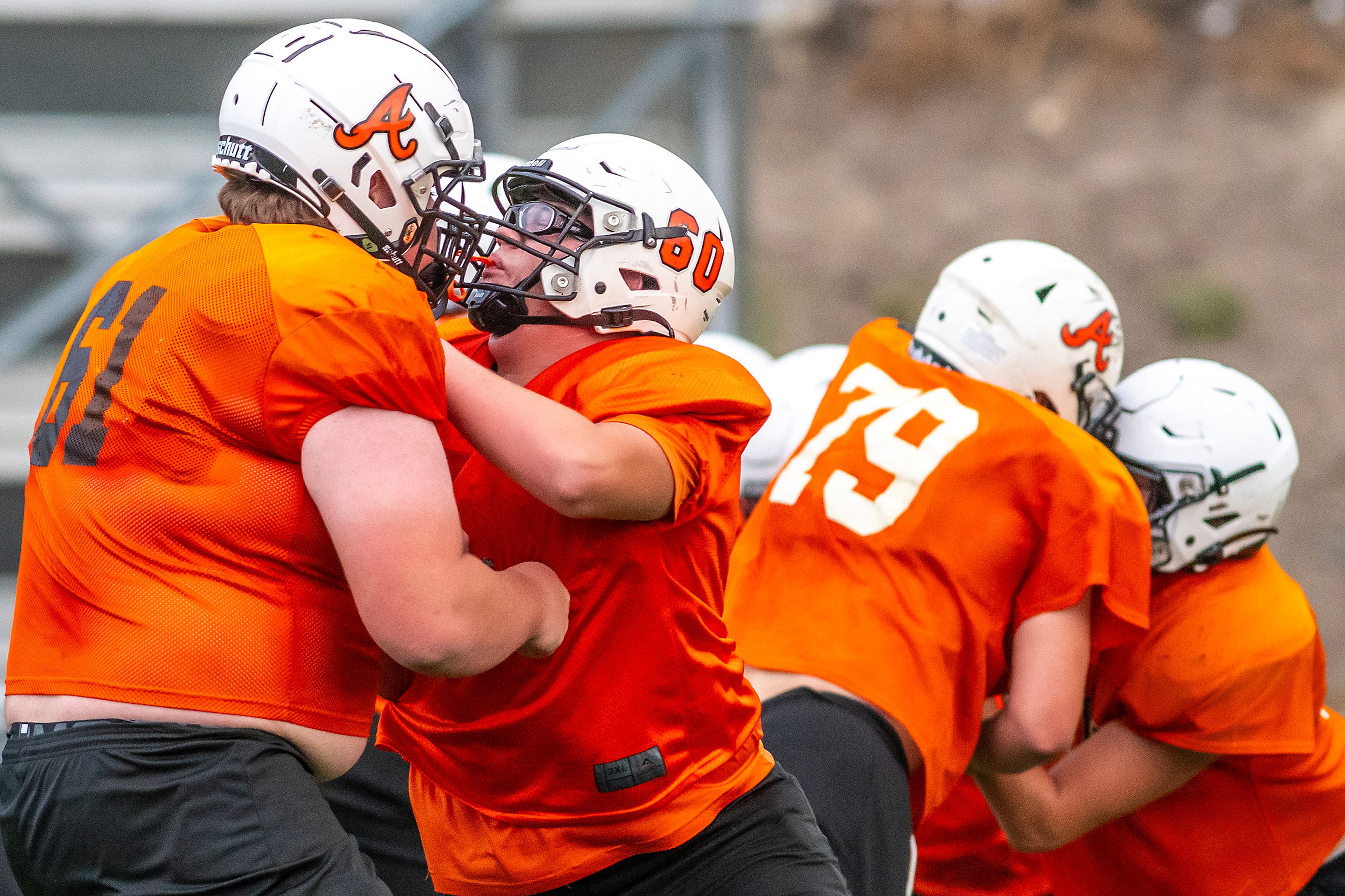 Defensive lineman hit each other at football practice Monday in Asotin.