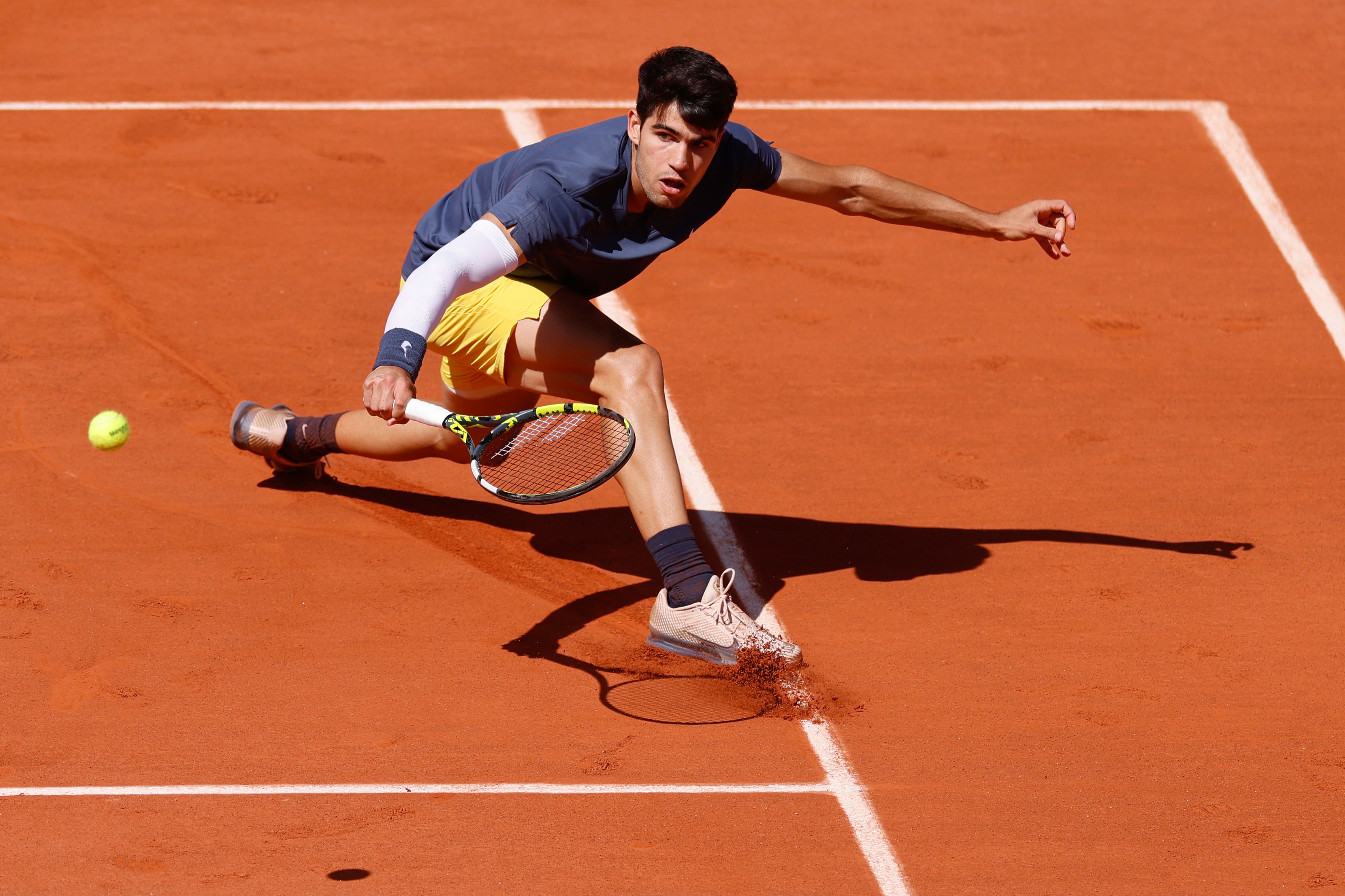 Spain's Carlos Alcaraz plays a shot against Germany's Alexander Zverev during the men's final of the French Open tennis tournament at the Roland Garros stadium in Paris, France, Sunday, June 9, 2024.