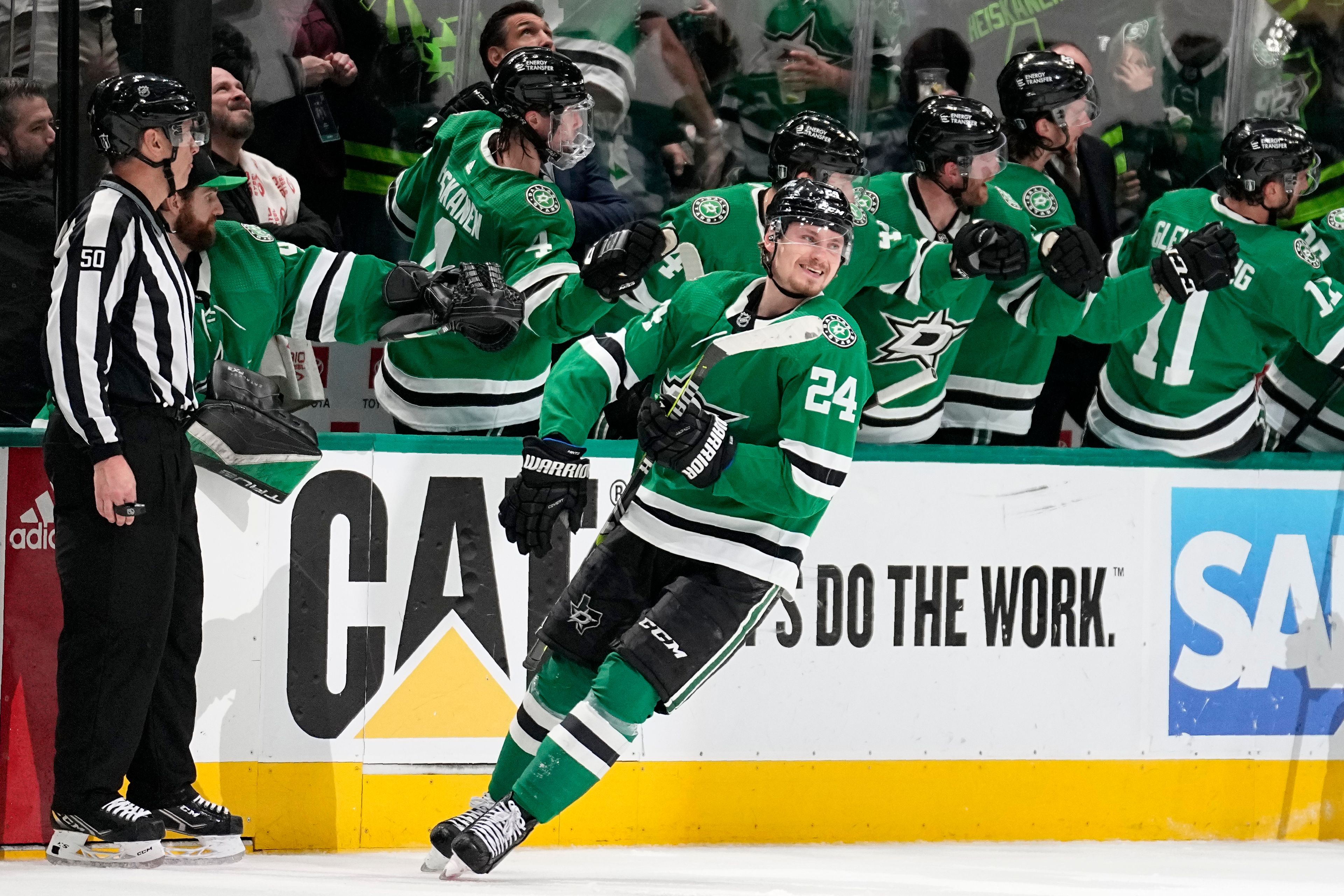 Dallas Stars center Roope Hintz (24) smiles as he celebrates with the bench after scoring against the Seattle Kraken in the second period of Game 7 of an NHL hockey Stanley Cup second-round playoff series, Monday, May 15, 2023, in Dallas. (AP Photo/Tony Gutierrez)