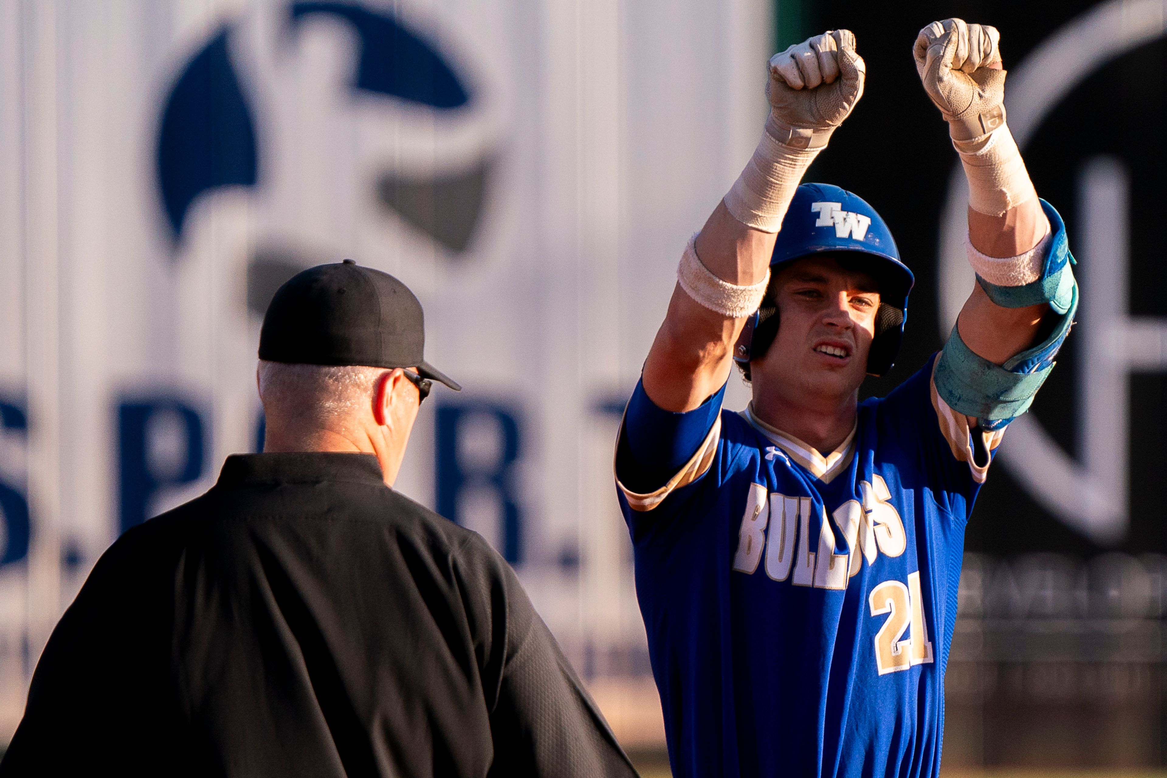 Tennessee Wesleyan’s Daniel Stewart (21) celebrates after hitting a double during Game 19 of the NAIA World Series against Hope International on Friday at Harris Field in Lewiston.