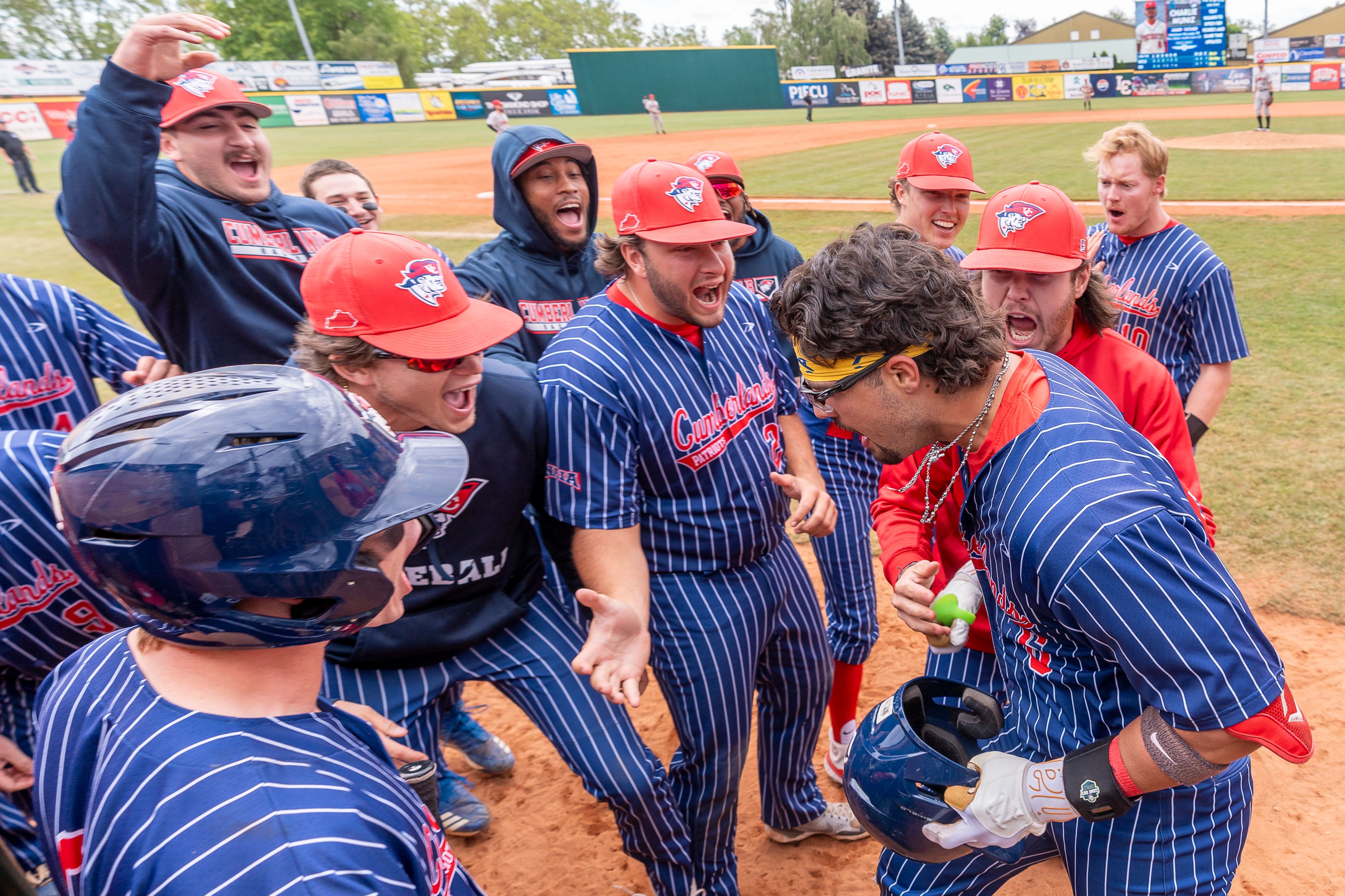 Cumberlands' Charlie Muñiz (6) celebrates with teammates after hitting a go-ahead grand slam during game 6 of the NAIA World Series against William Carey on Saturday at Harris Field in Lewiston.