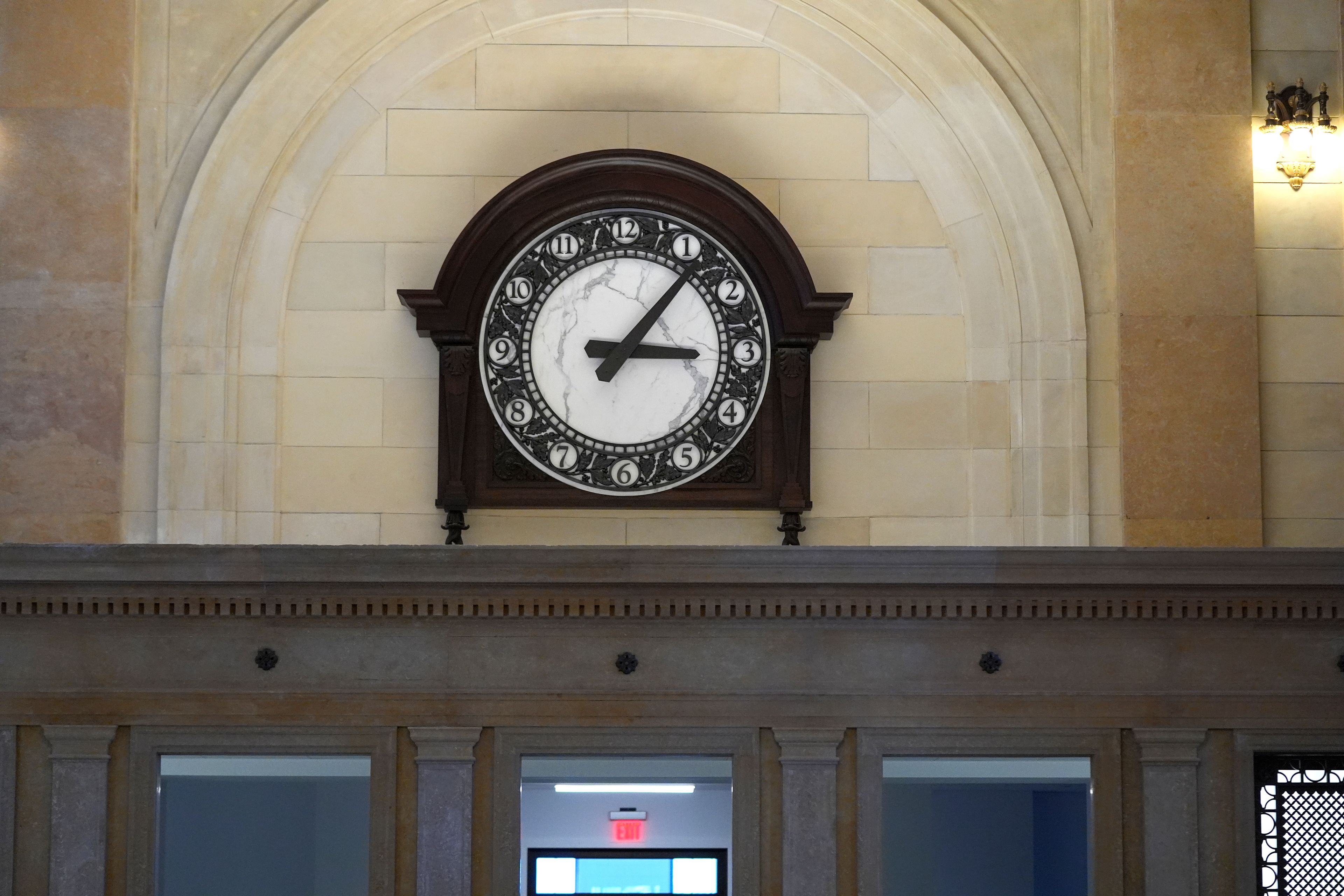 A newly crafted clock above the former ticket windows at the Michigan Central Station is seen, Monday, May 13, 2024 in Detroit. A once hulking scavenger-ravaged monolith that symbolized Detroit's decline reopens this week after a massive six-year multimillion dollar renovation by Ford Motor Co., which restored the Michigan Central Station to its past grandeur with a focus squarely on the future of mobility.