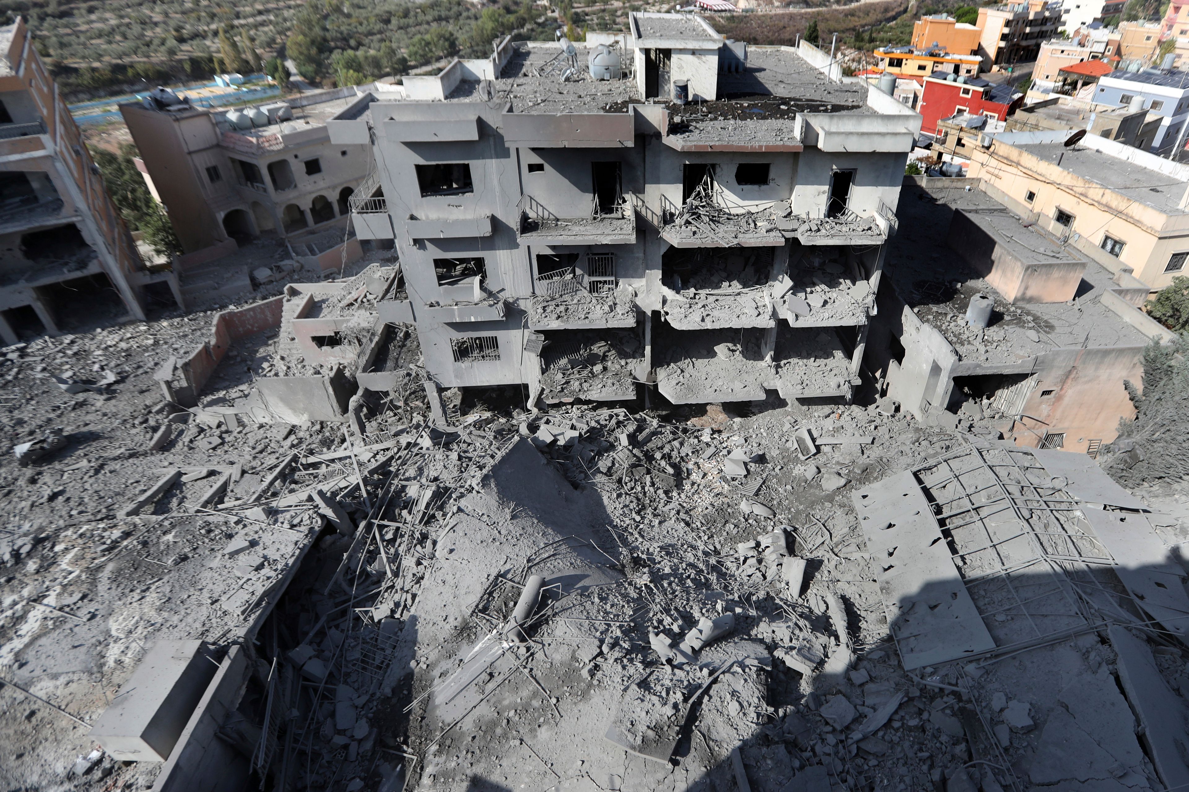 Destroyed buildings that were hit by Israeli airstrikes are seen in Qana village, south Lebanon, Wednesday, Oct. 16, 2024. (AP Photo/Mohammed Zaatari)