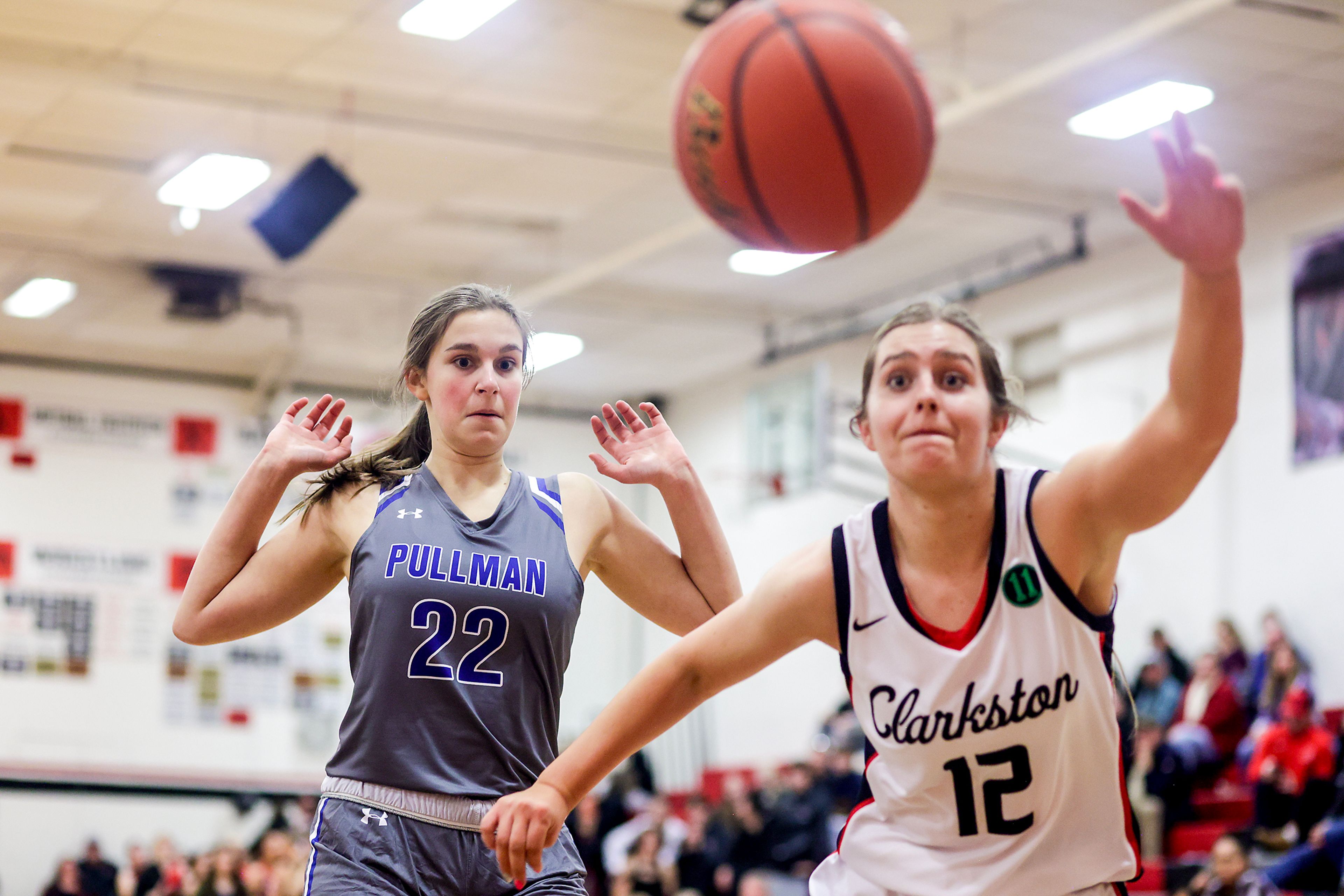 Clarkston post Ryann Combs, right, goes after a loose ball as Pullman post Marissa Carper looks on during Tuesday's Class 2A Greater Spokane League girls basketball game.