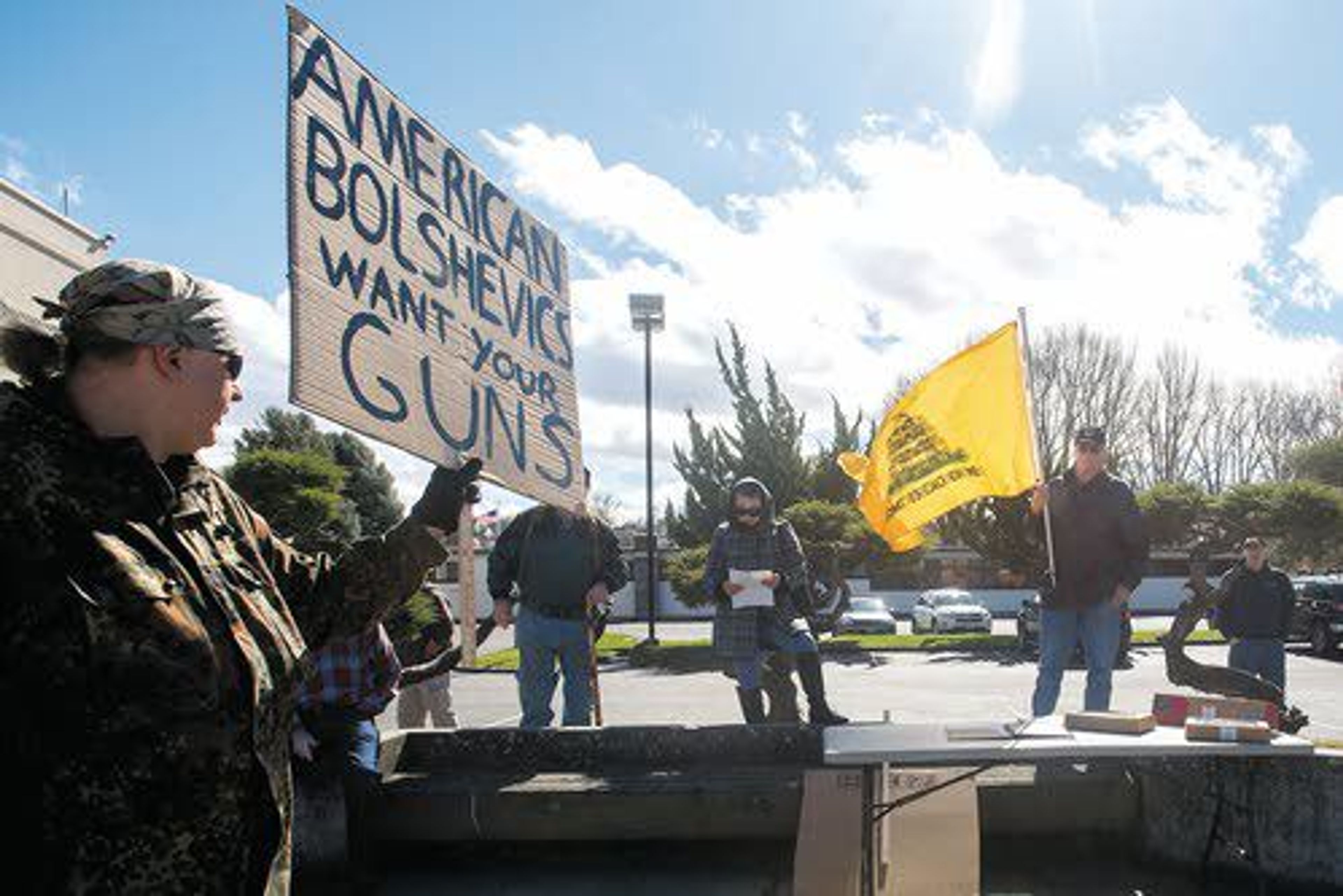 Mike Dietz (left) stands alongside fellow gun-rights supporters during a pro Second Amendment rally Saturday outside the Nez Perce County Courthouse in Lewiston.