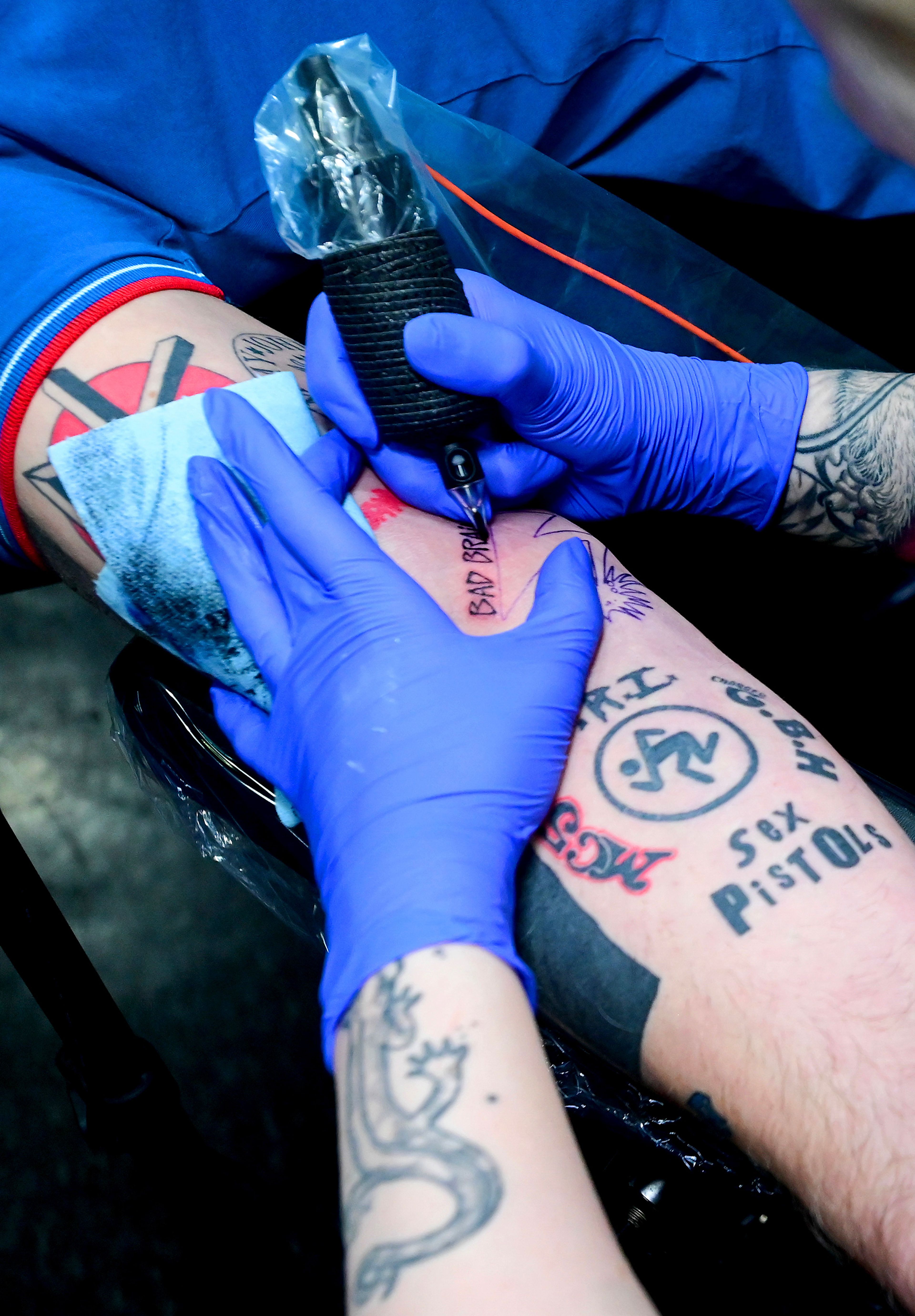 Tattoo artist Sarah Bailey works on new ink for Lee Fleming, of Pullman, at Blood Diamond Ink on Friday, Feb. 23.