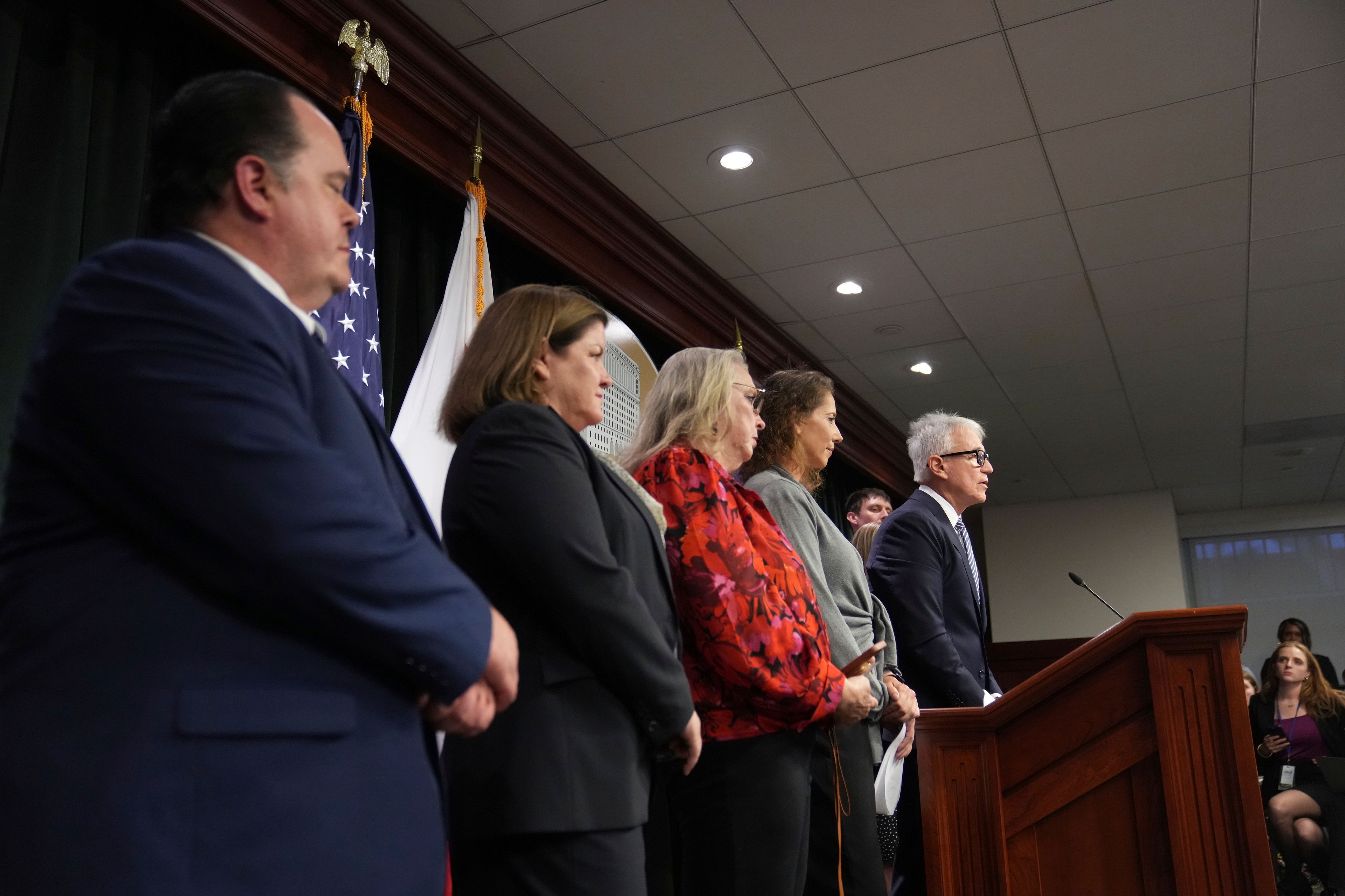 Los Angeles County District Attorney George Gascon, right, flanked by Menendez family members, speaks during a news conference at the Hall of Justice, Thursday, Oct. 24, 2024, in Los Angeles. (AP Photo/Eric Thayer)