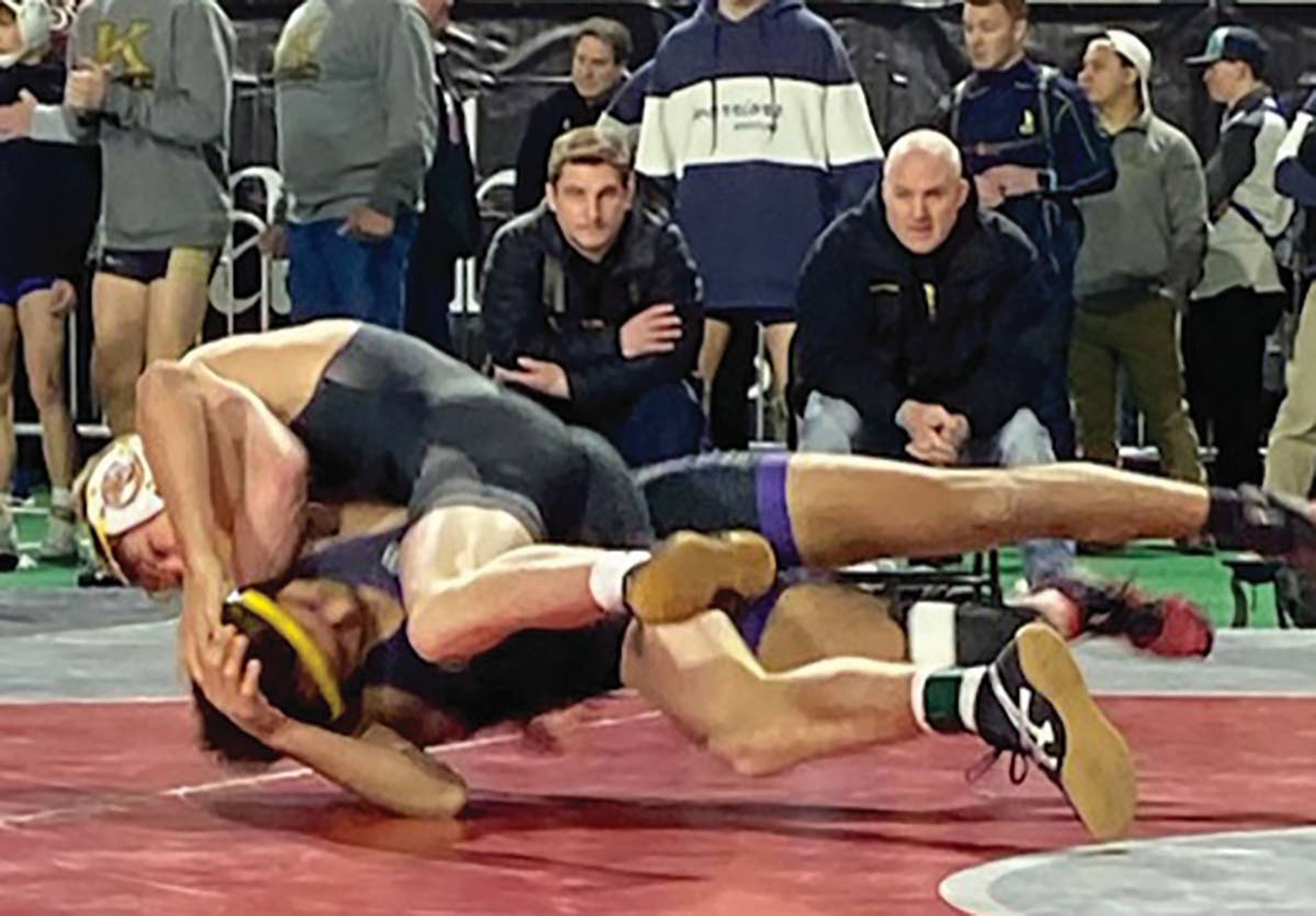 Lewiston senior Tristan Bremer takes down his opponent in the 132-pound division during Saturday’s Class 5A state wrestling meet at Holt Arena in Pocatello. Bremer won the title, his second in his career.