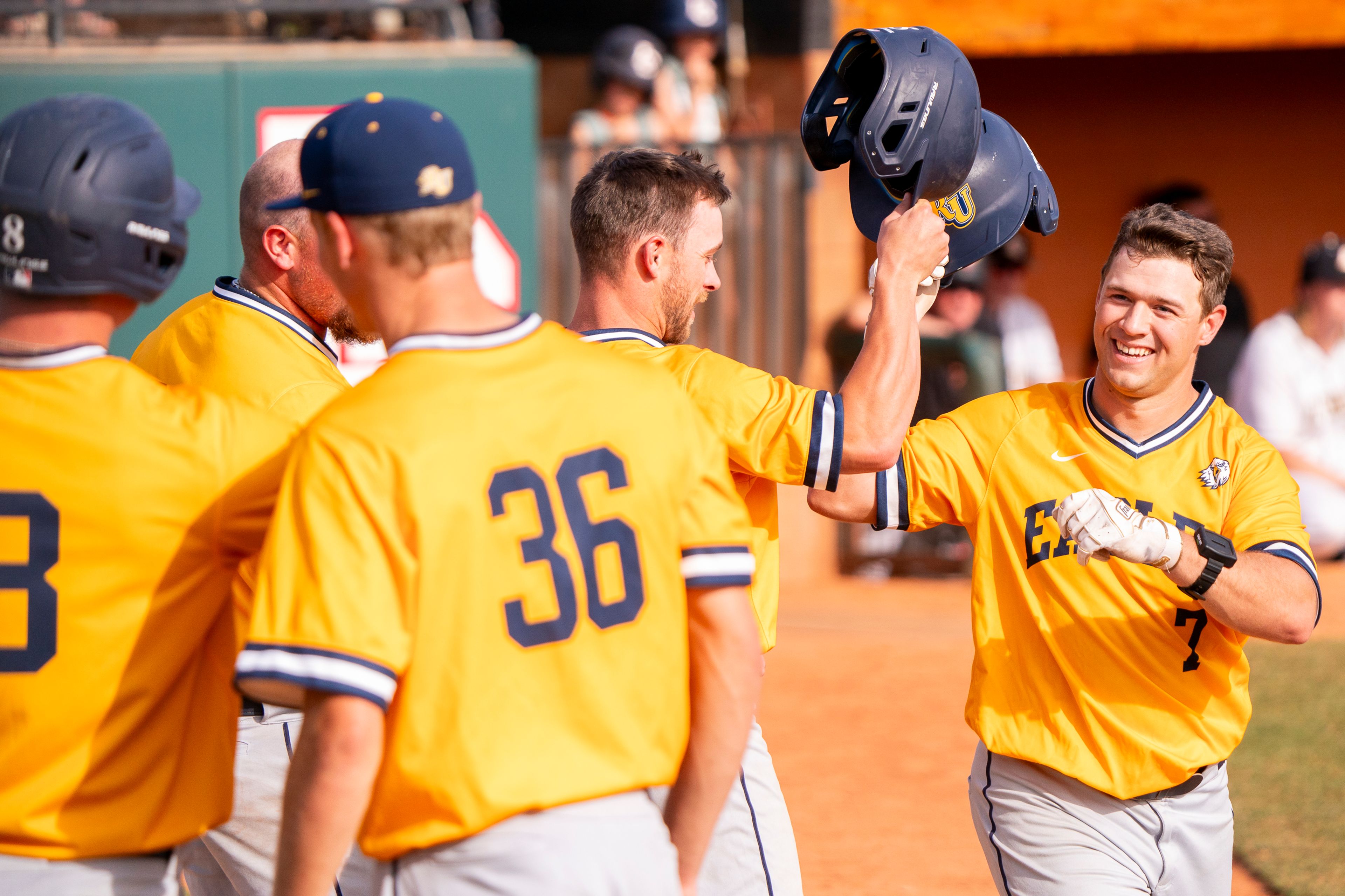 Reinhardt’s Tucker Zdunich (7) celebrates with teammates after hitting his second home run during game 11 of the NAIA World Series against Arizona Christian on Monday at Harris Field in Lewiston.