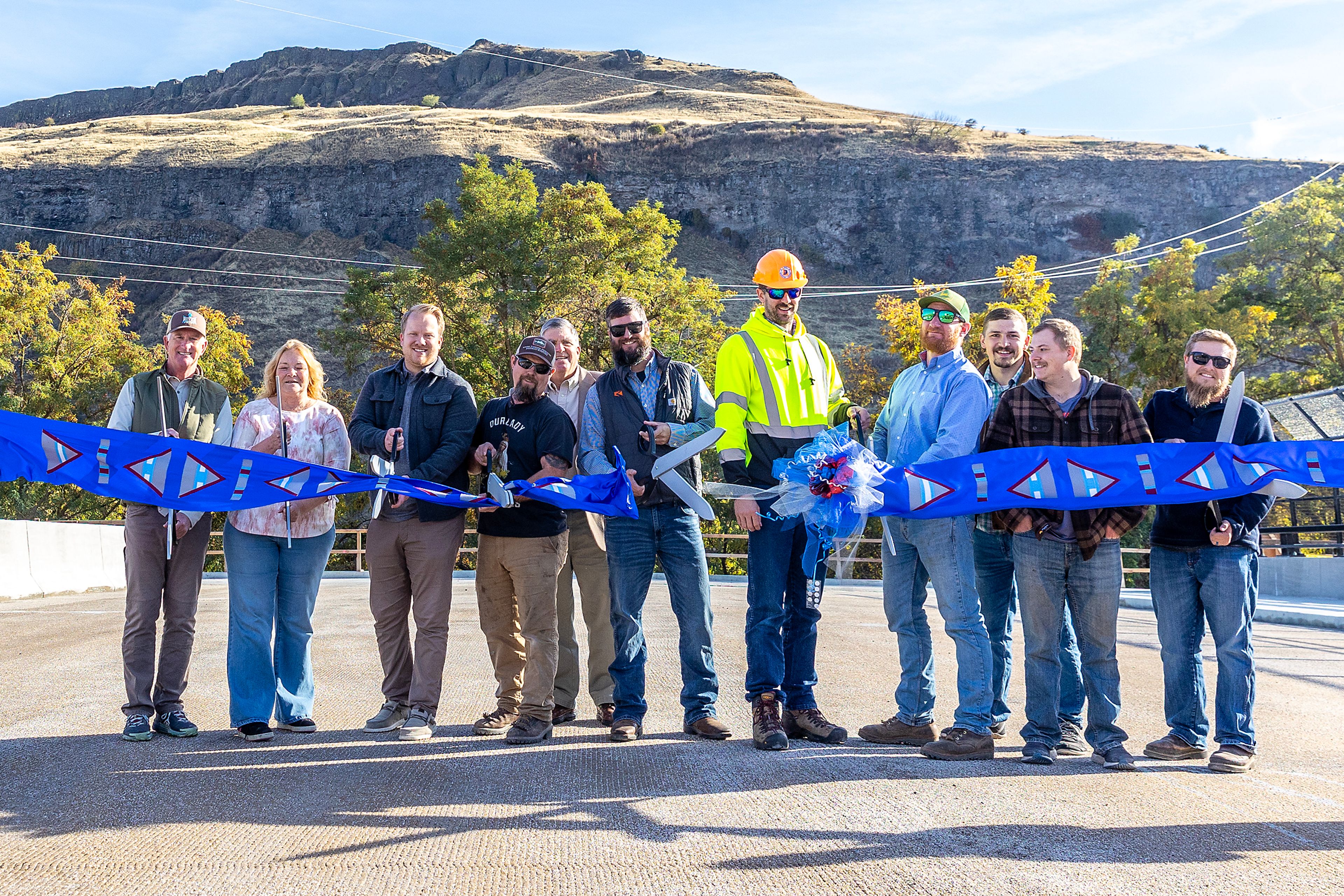 The construction team cuts the ribbon Thursday for the Aht�Wy Interchange over U.S. Highway 95/12 in Lewiston.