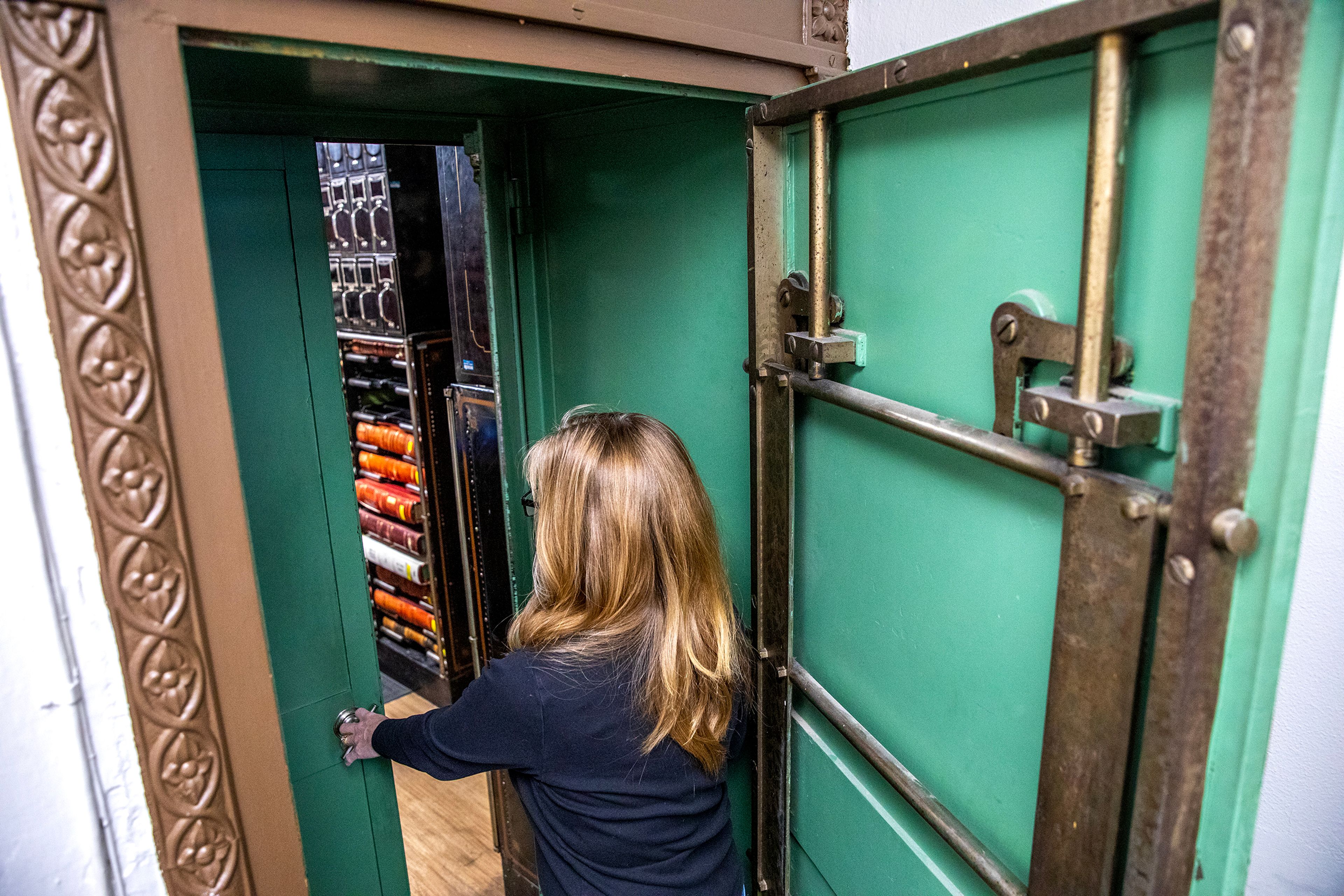 Patty Weeks opens one of the metal safe doors that will be saved and put in the new courthouse Friday at the Nez Perce County Courthouse in Lewiston.