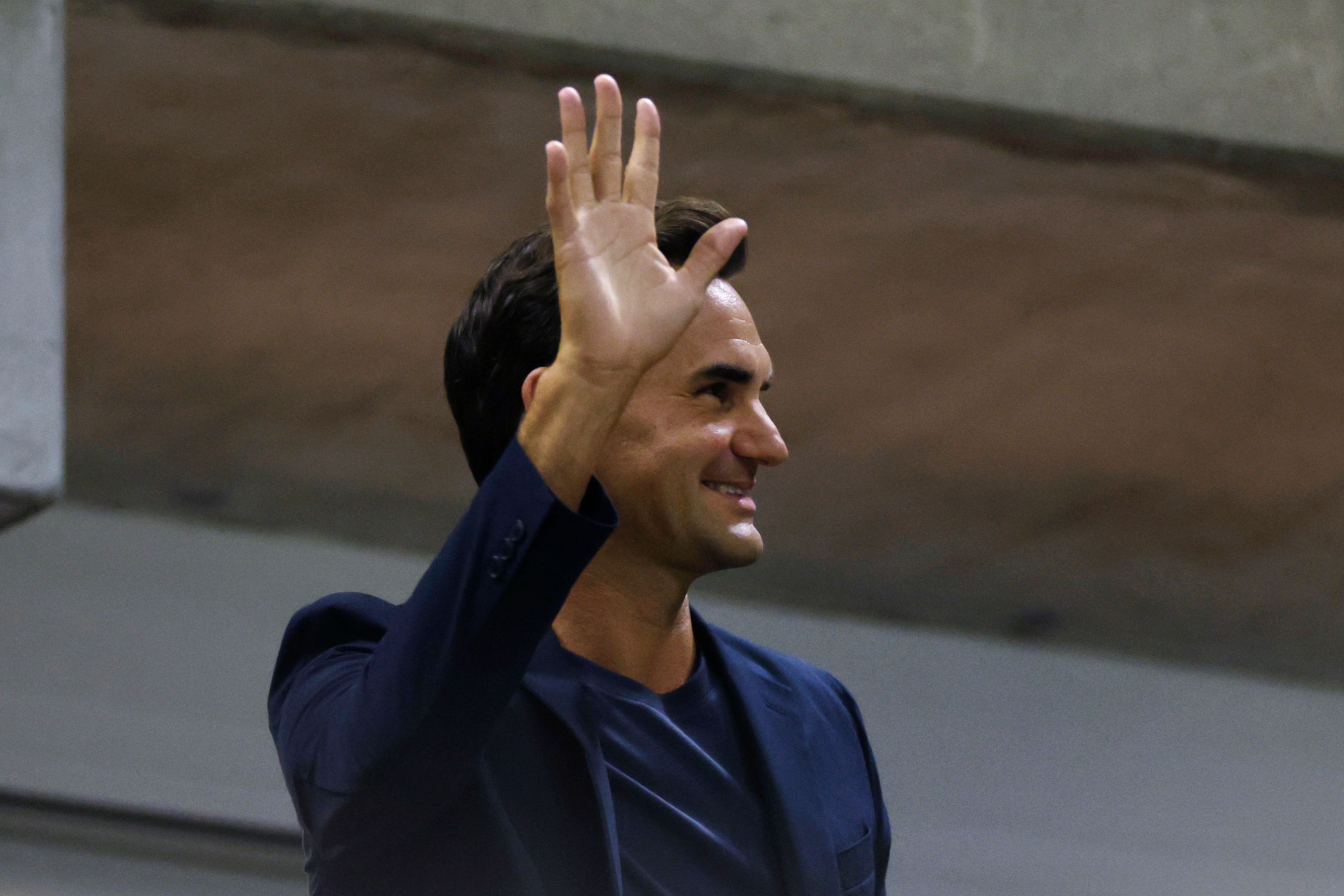 Tennis great Roger Federer waves to the crowd during the quarterfinal match between Aryna Sabalenka, of Belarus, and Zheng Qinwen, of China, during the U.S. Open tennis championships, Tuesday, Sept. 3, 2024, in New York.