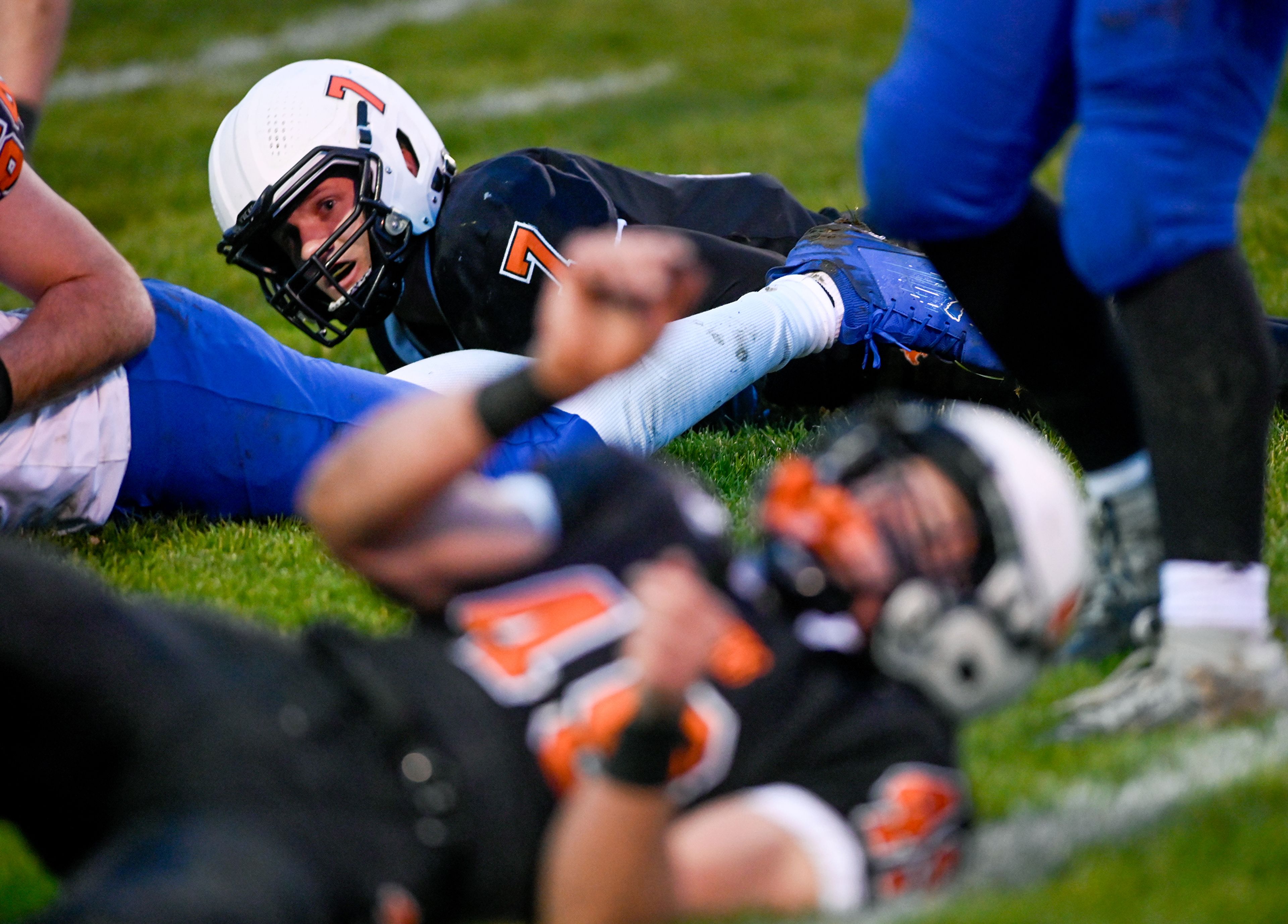 Asotin’s Cody Ells looks up from the ground after tackling La Salle’s Adan Villalobos Saturday during a Washington 2B state tournament game in Clarkston.