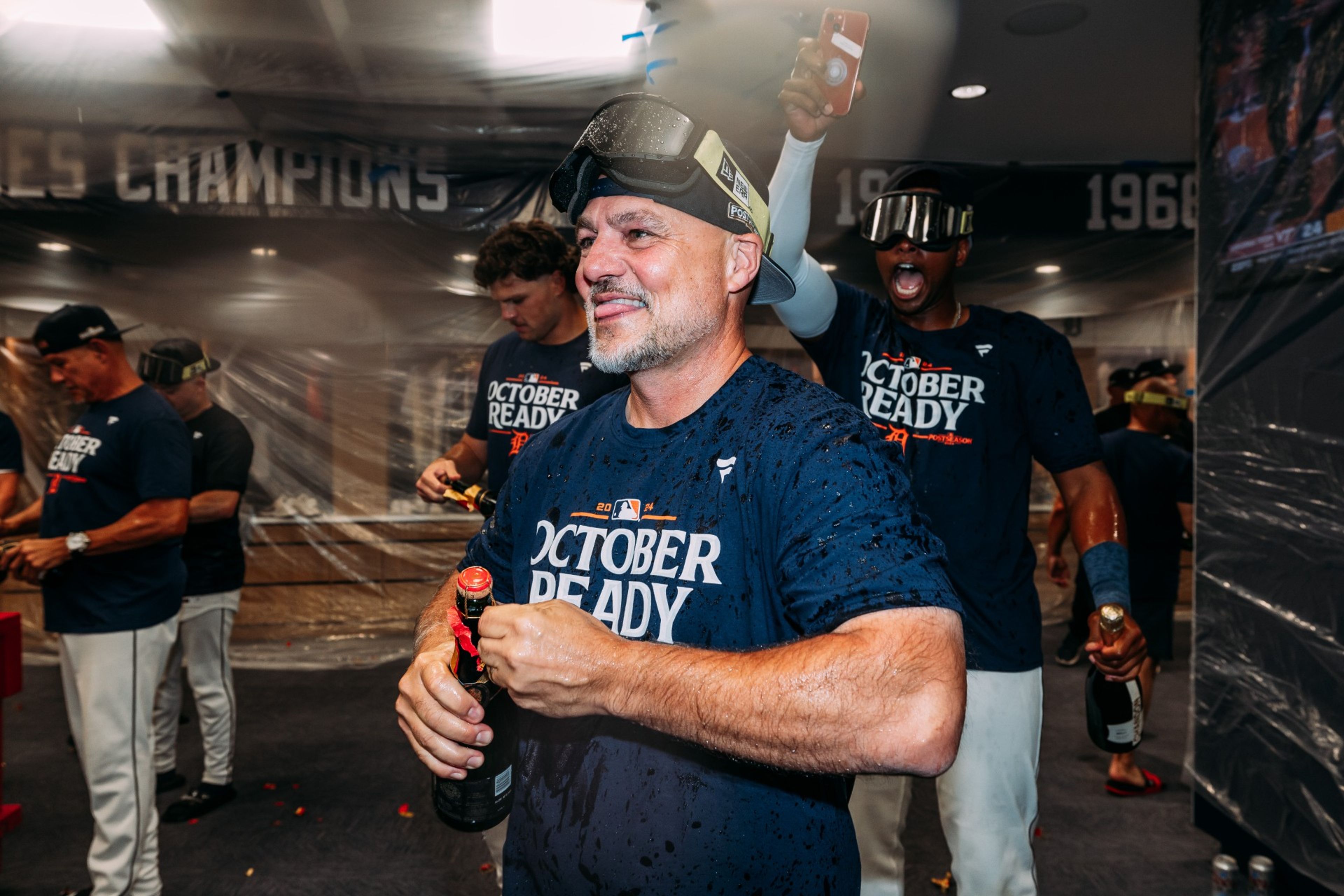 Robin Lund celebrates the Tigers’ 2024 playoff berth in the clubhouse on Sept. 27, 2024, in Detroit.