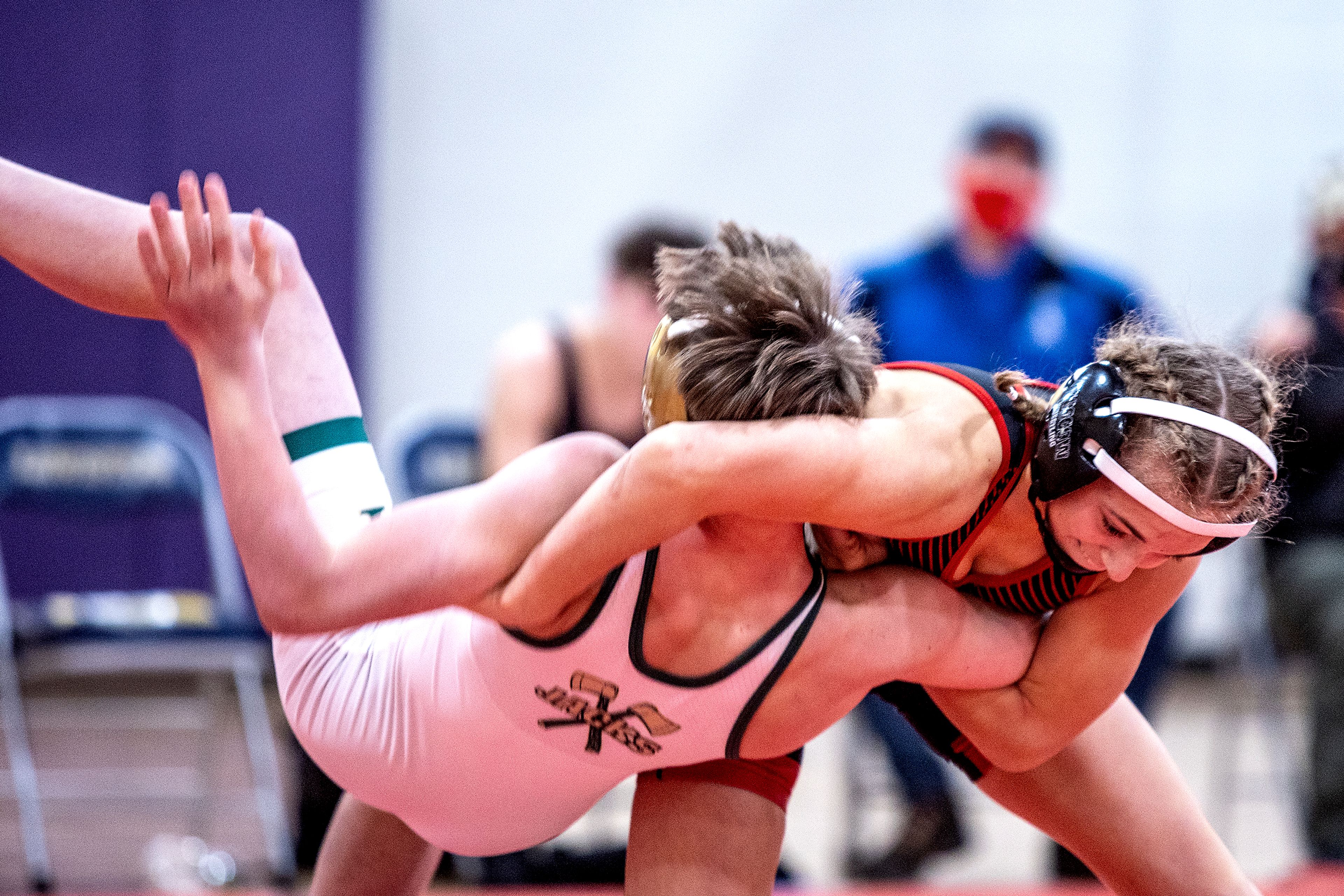 Moscow’s Skyla Zimmerman flips St. Maries’ Brock Anderson to the mat en route to a pin to win the 106-pound championship match in the Jan. 23, 2021, Clearwater Classic at Lewiston High School.