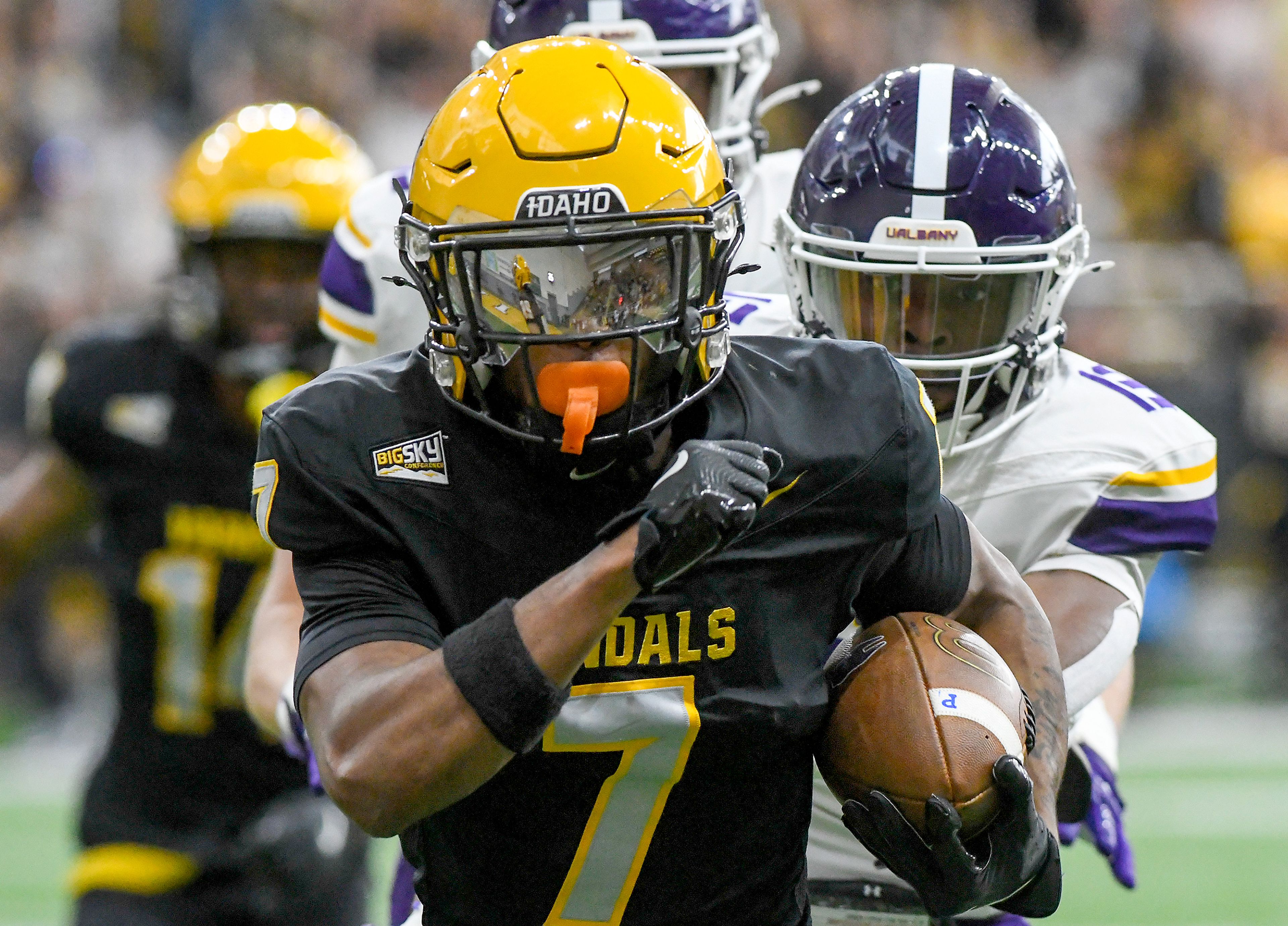 
Idaho Vandals defensive back Andrew Marshall (7) carries the ball past Albany Great Danes defenders for a touchdown on Sept. 14 at the P1FCU Kibbie Dome in Moscow.