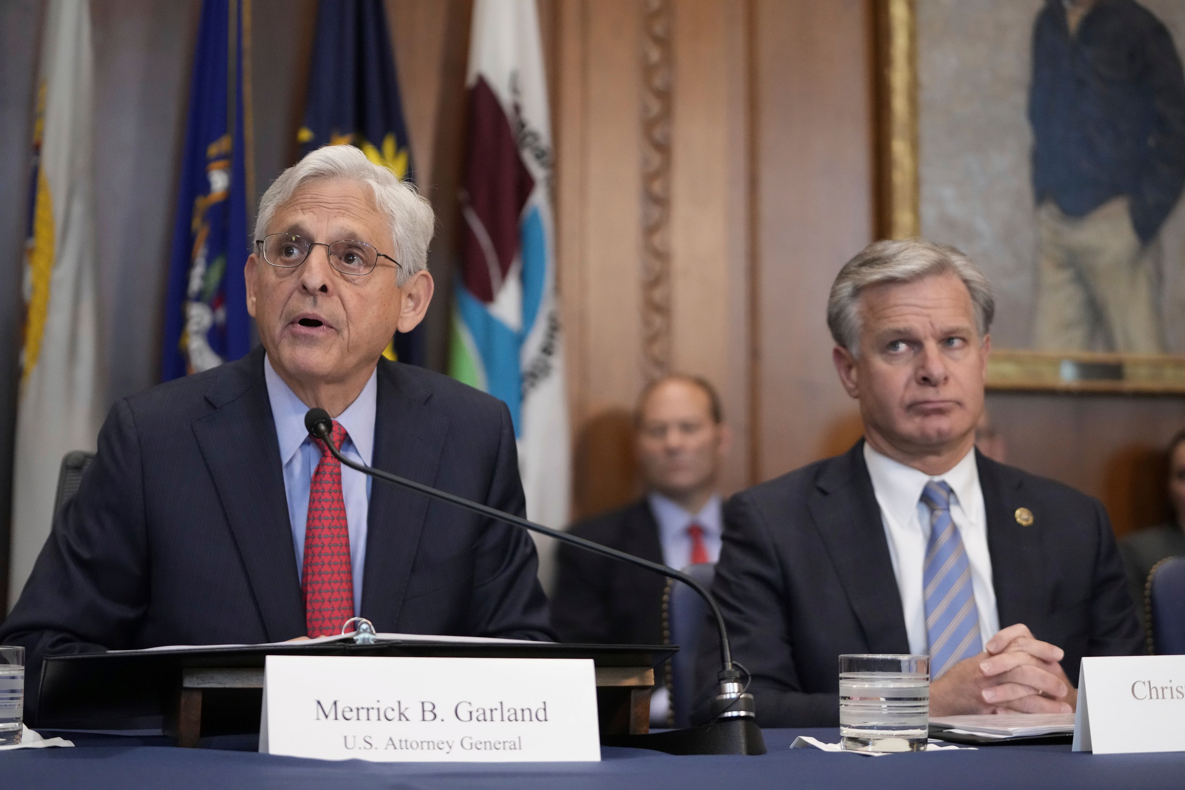 Attorney General Merrick Garland speaks during a meeting of the Justice Department's Election Threats Task Force, at the Department of Justice, Wednesday, Sept. 4, 2024, in Washington, with FBI Director Christopher Wray, right. (AP Photo/Mark Schiefelbein)