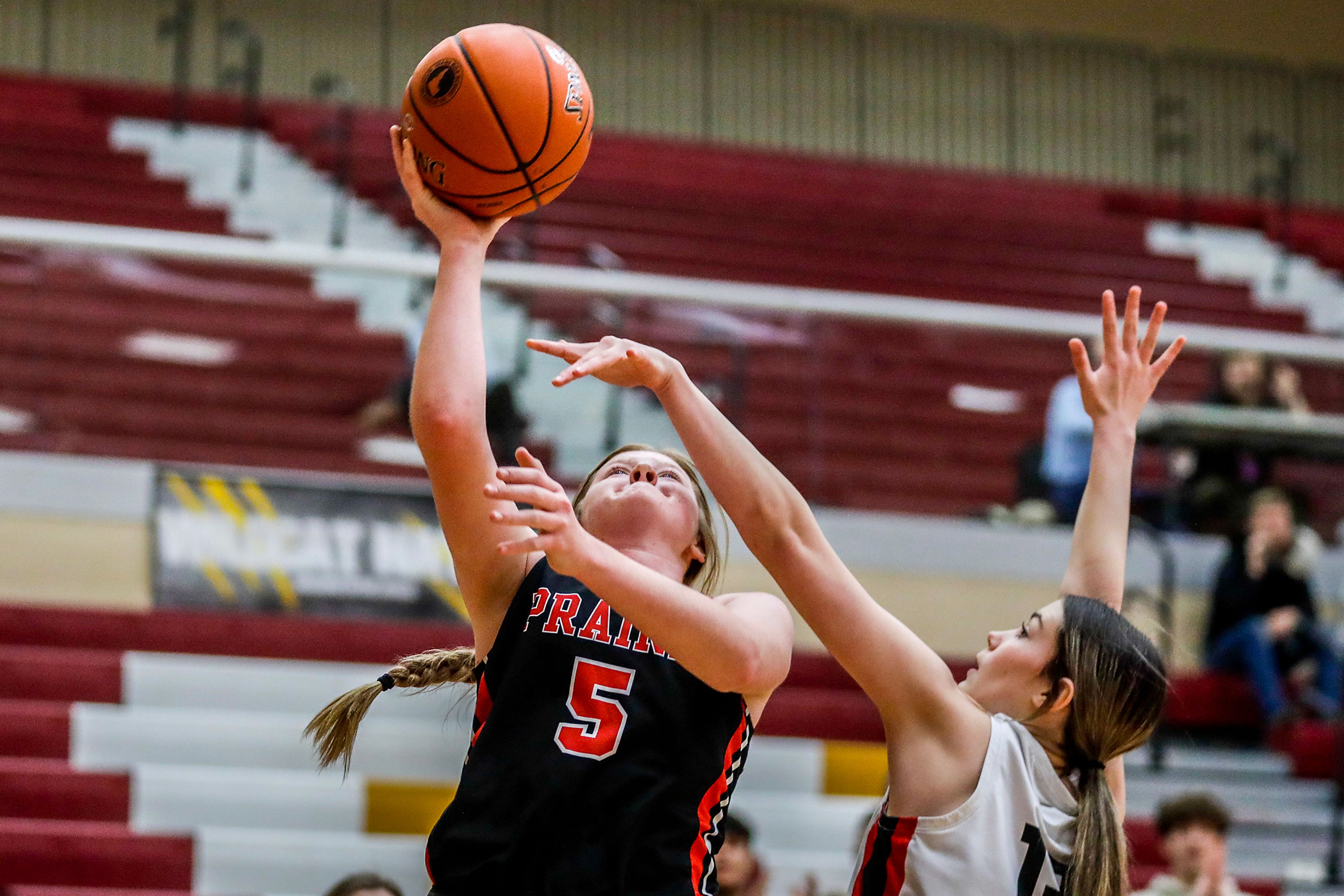 Prairie guard Hailey Hanson shoots a layup as Murtaugh forward Bristyl Perkins guards her during a quarterfinal game in the girls 1A DI state tournament Thursday at Columbia High School in Nampa.