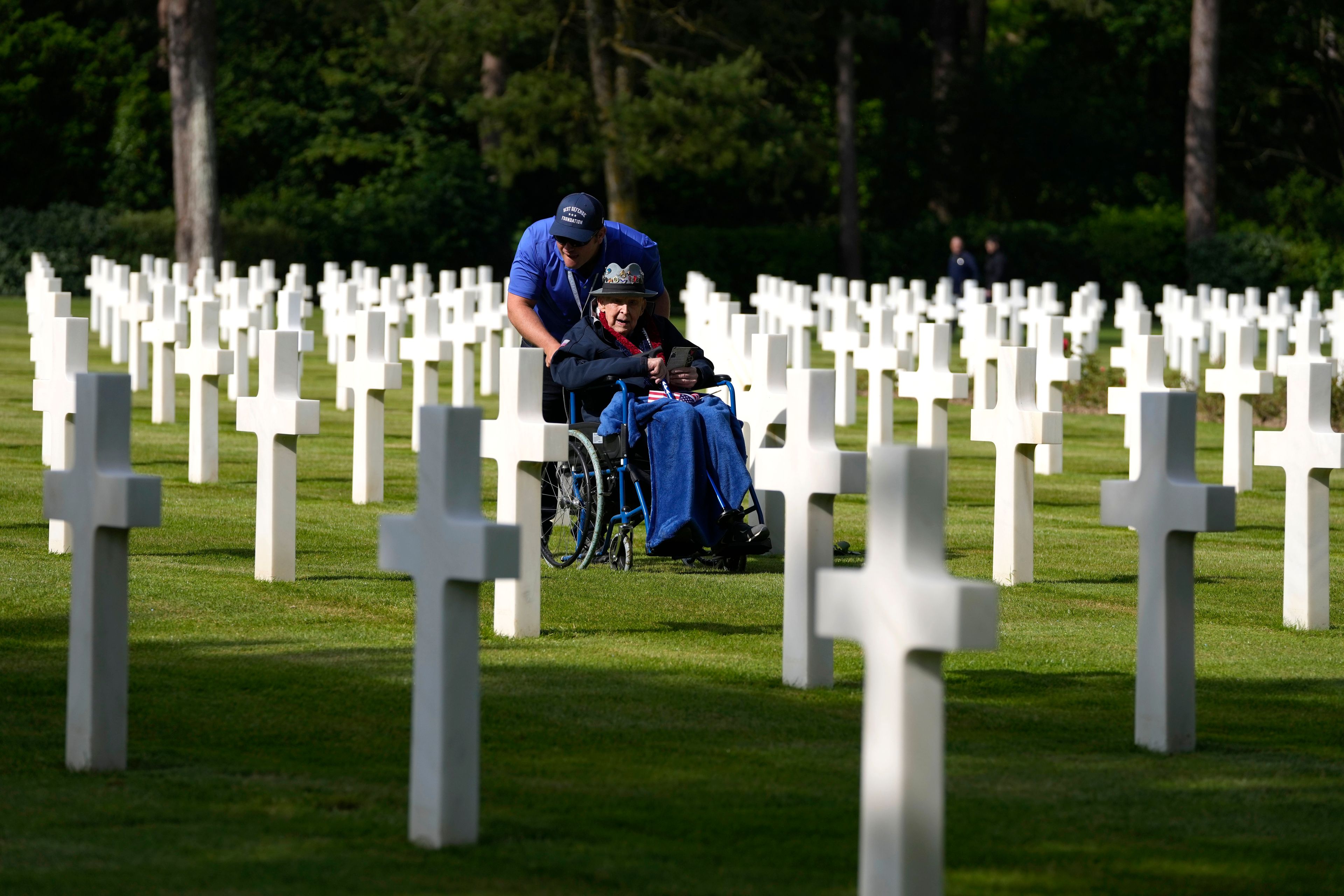 World War II and D-Day veteran Jake Larson visits the graves at the Normandy American Cemetery in Colleville-sur-Mer, Tuesday, June 4, 2024. World War II veterans from across the United States as well as Britain and Canada are in Normandy this week to mark 80 years since the D-Day landings that helped lead to Hitler's defeat. (AP Photo/Virginia Mayo)