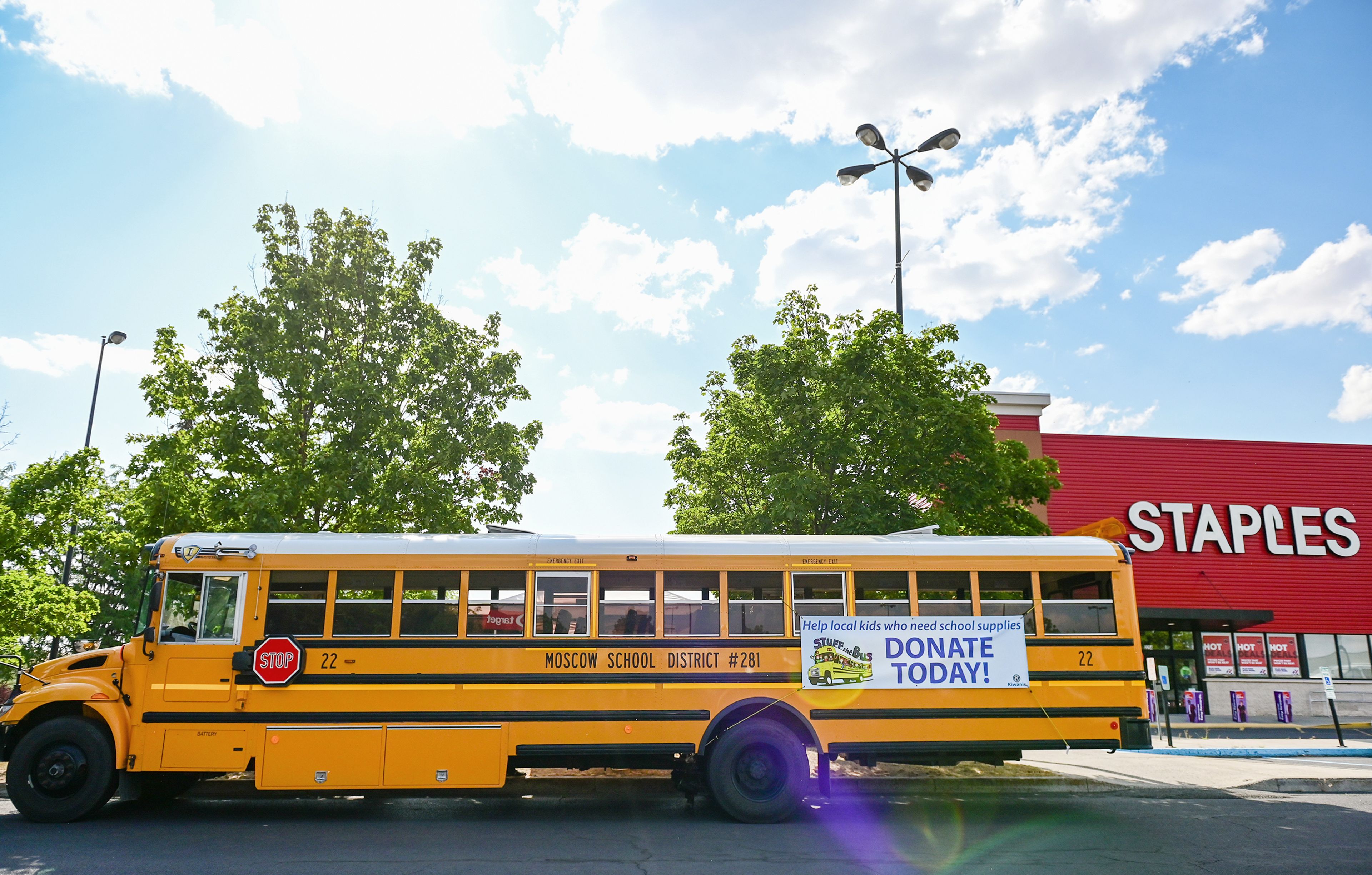 A Moscow school district bus sits in the Staples parking lot on Thursday in Moscow for the Stuff the Bus school supplies drive.