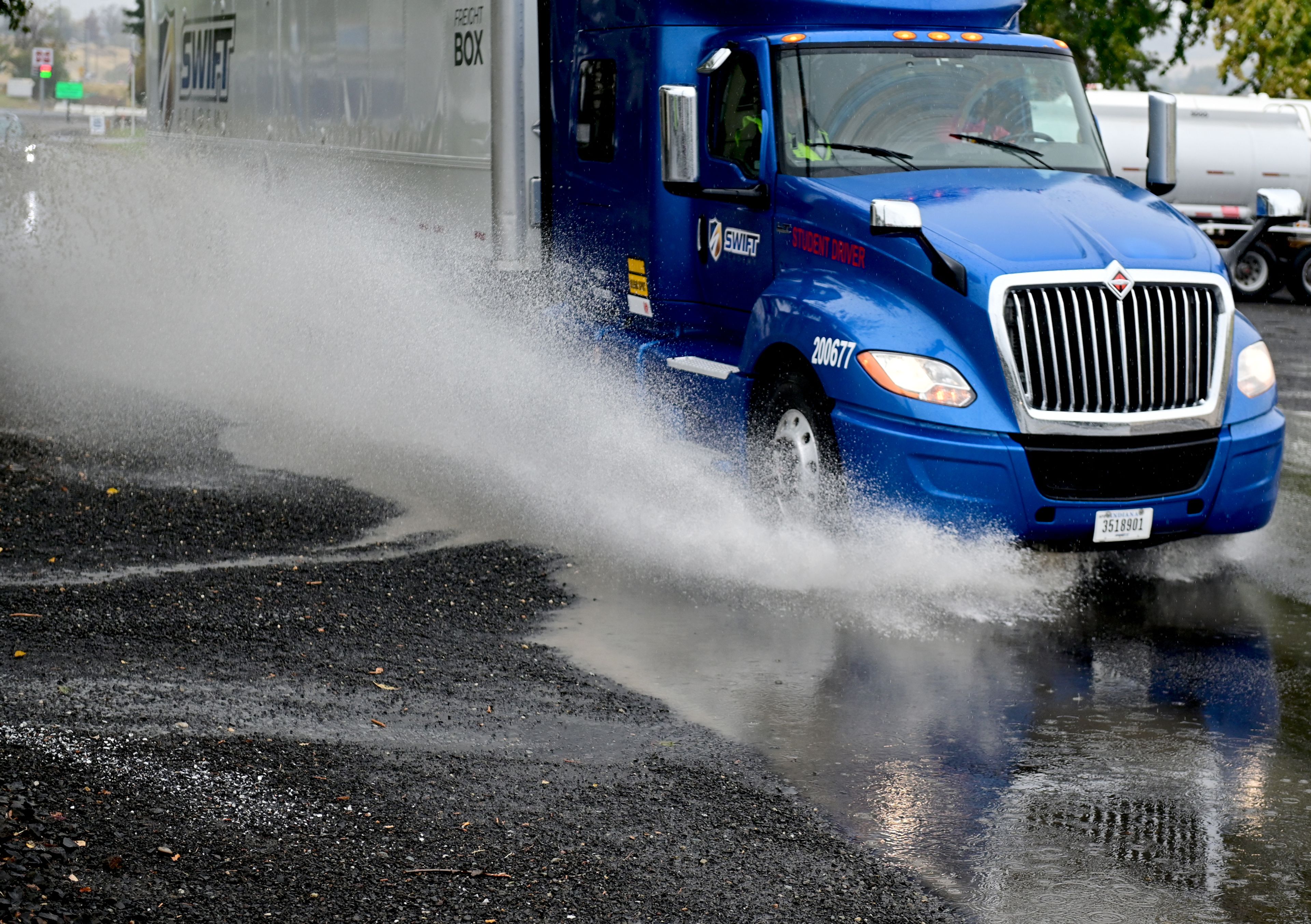 A semi drives through rain water pooling along Snake River Avenue on Monday in Lewiston.