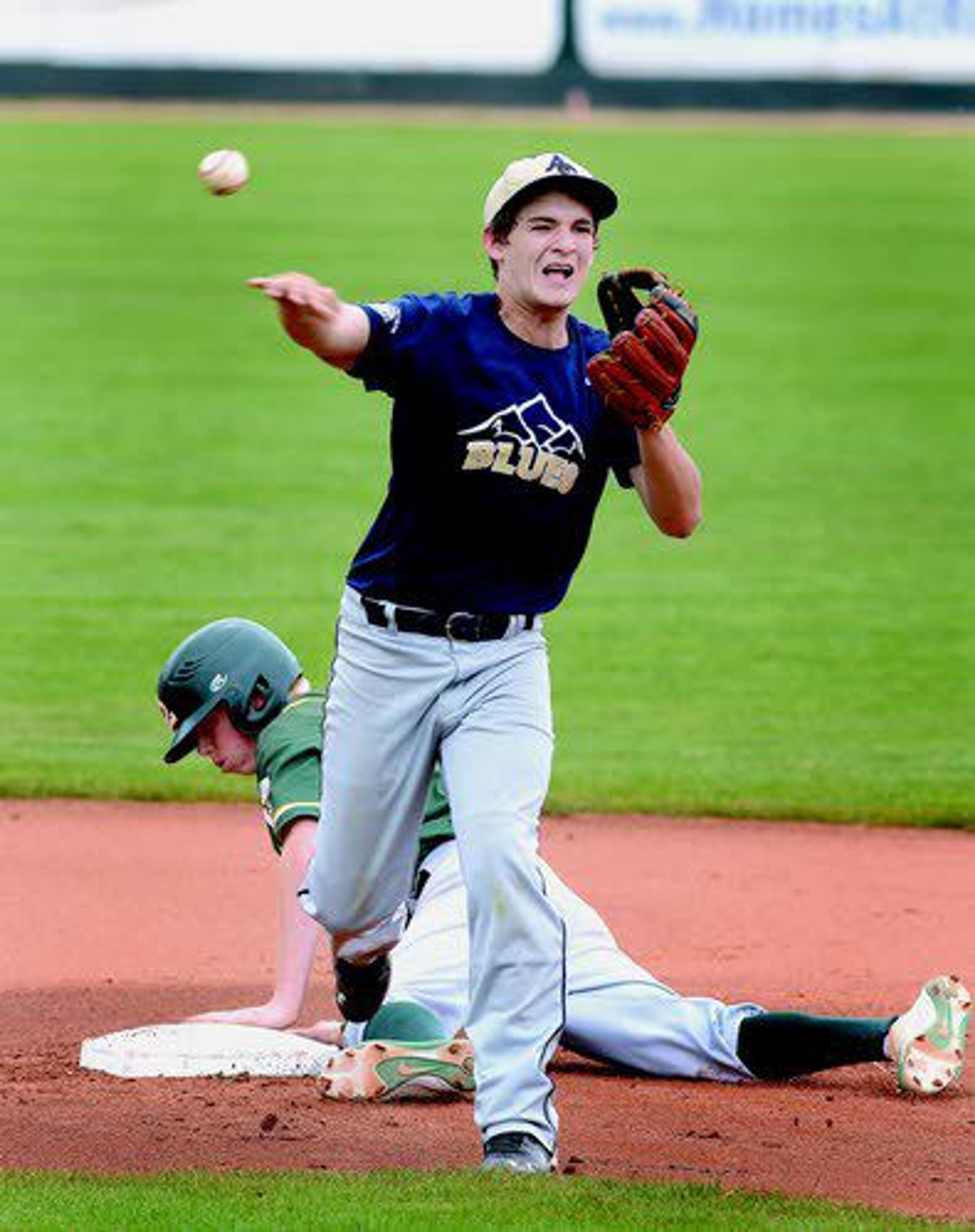 Asotin County’s Dalton James fires ball to first base after forcing out Cubs’ Jonah Carpenter at second base to start the double play in in second inning action Thursday at Harris Field.