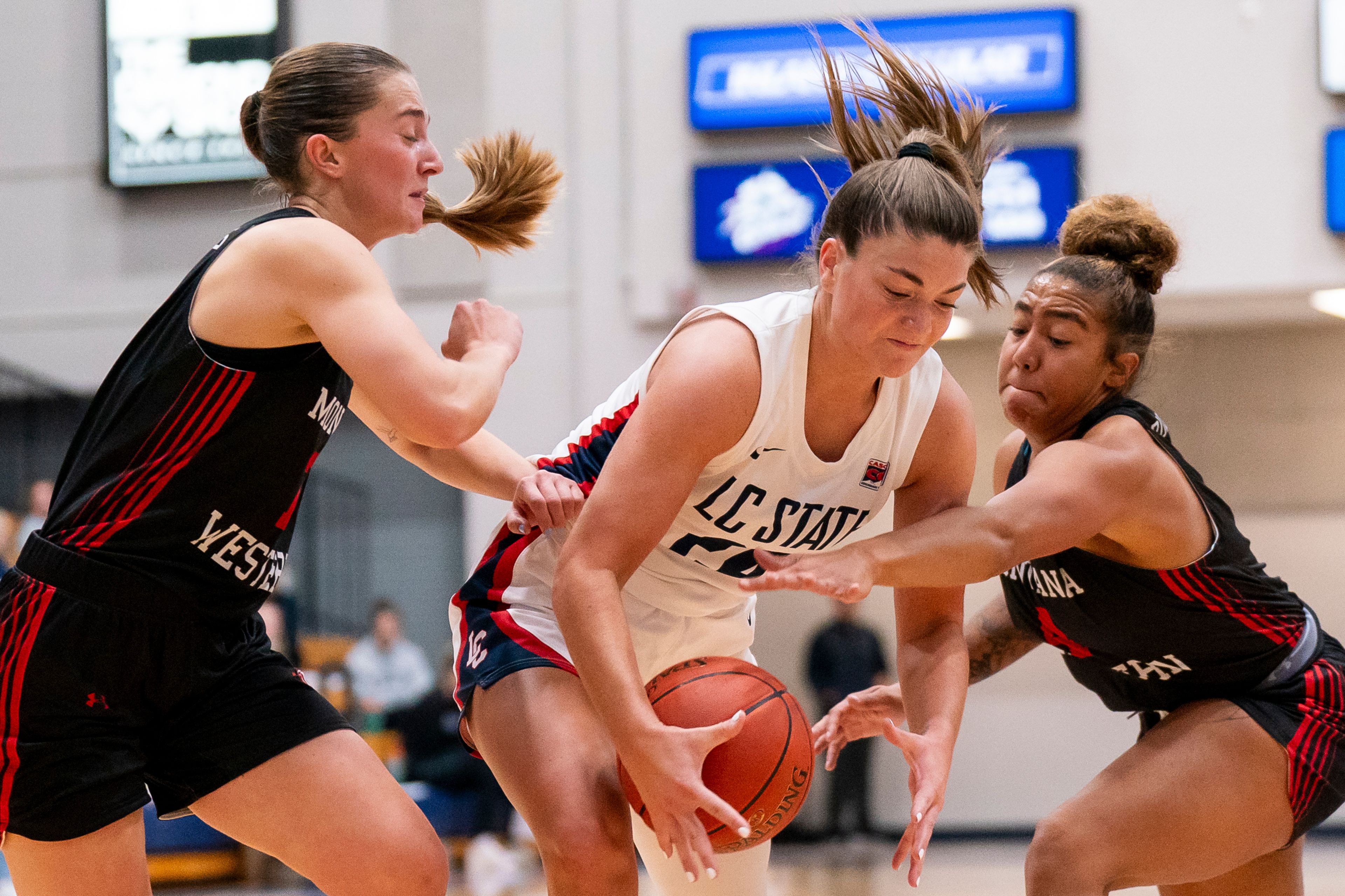 Lewis-Clark State College guard Payton Hymas, center, drives to the basket during a game Nov. 10, 2023, against Montana Western on at the P1FCU Activity Center in Lewiston.,