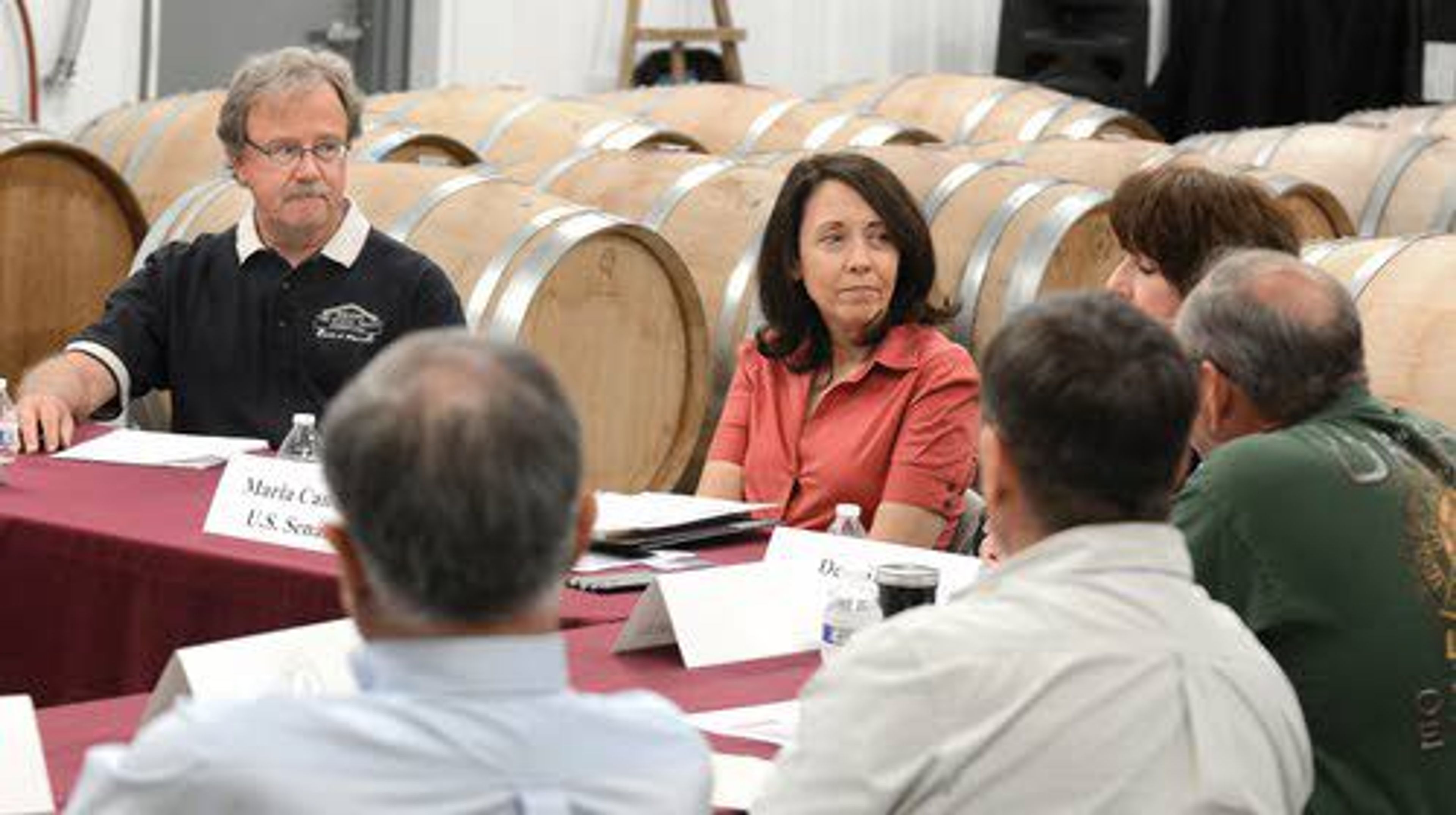 U.S. Sen. Maria Cantwell, D-Wash., listens Tuesday to wine producers talk about their industry and the challenges they face during a discussion at Basalt Cellars in Clarkston. Also shown in the photo (at left) is Rick Wasem, one of the partners in Basalt Cellars.