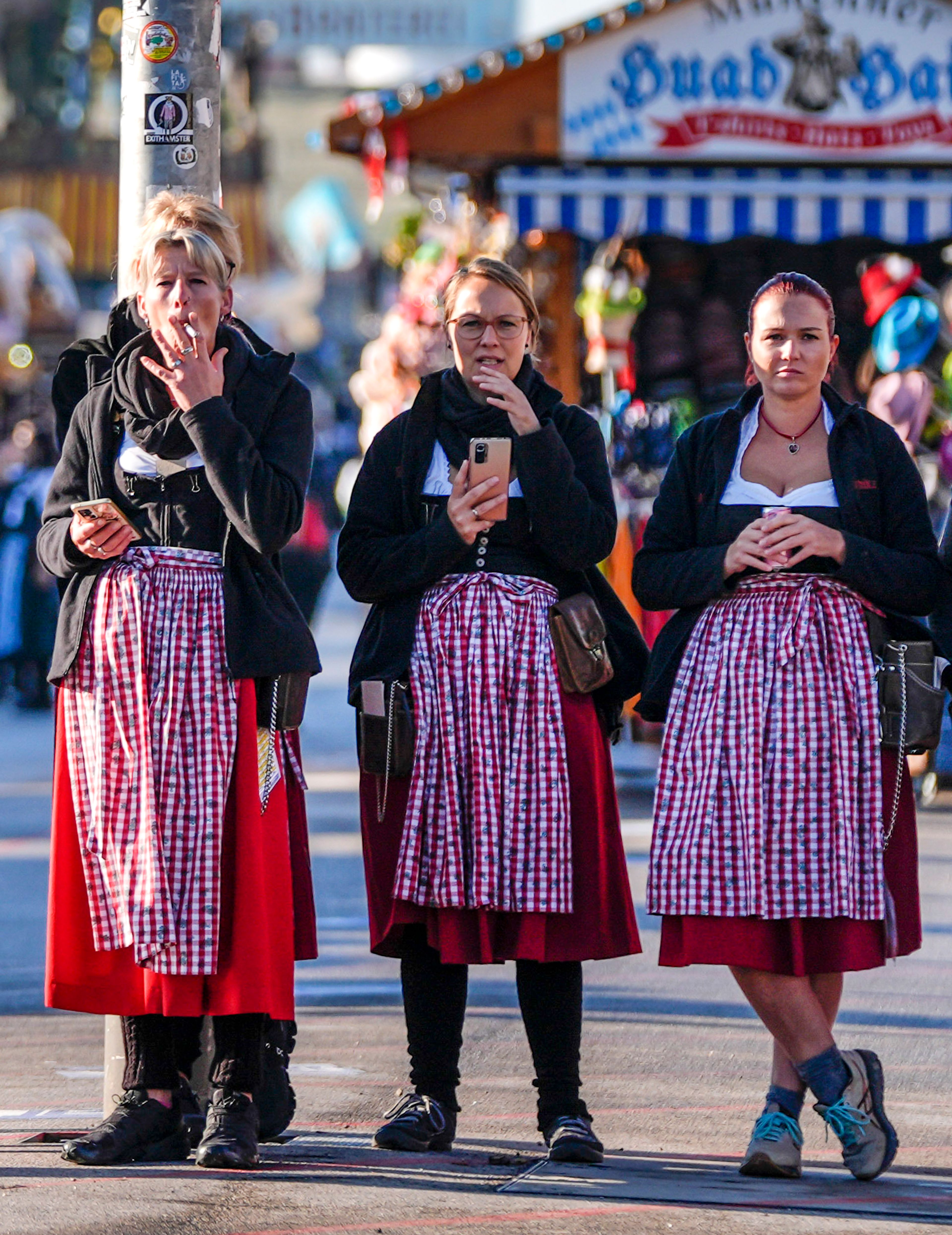 Waitresses wait for the gates to open, before the start of the 189th 'Oktoberfest' beer festival in Munich, Germany, Saturday, Sept. 21, 2024. (AP Photo/Matthias Schrader),