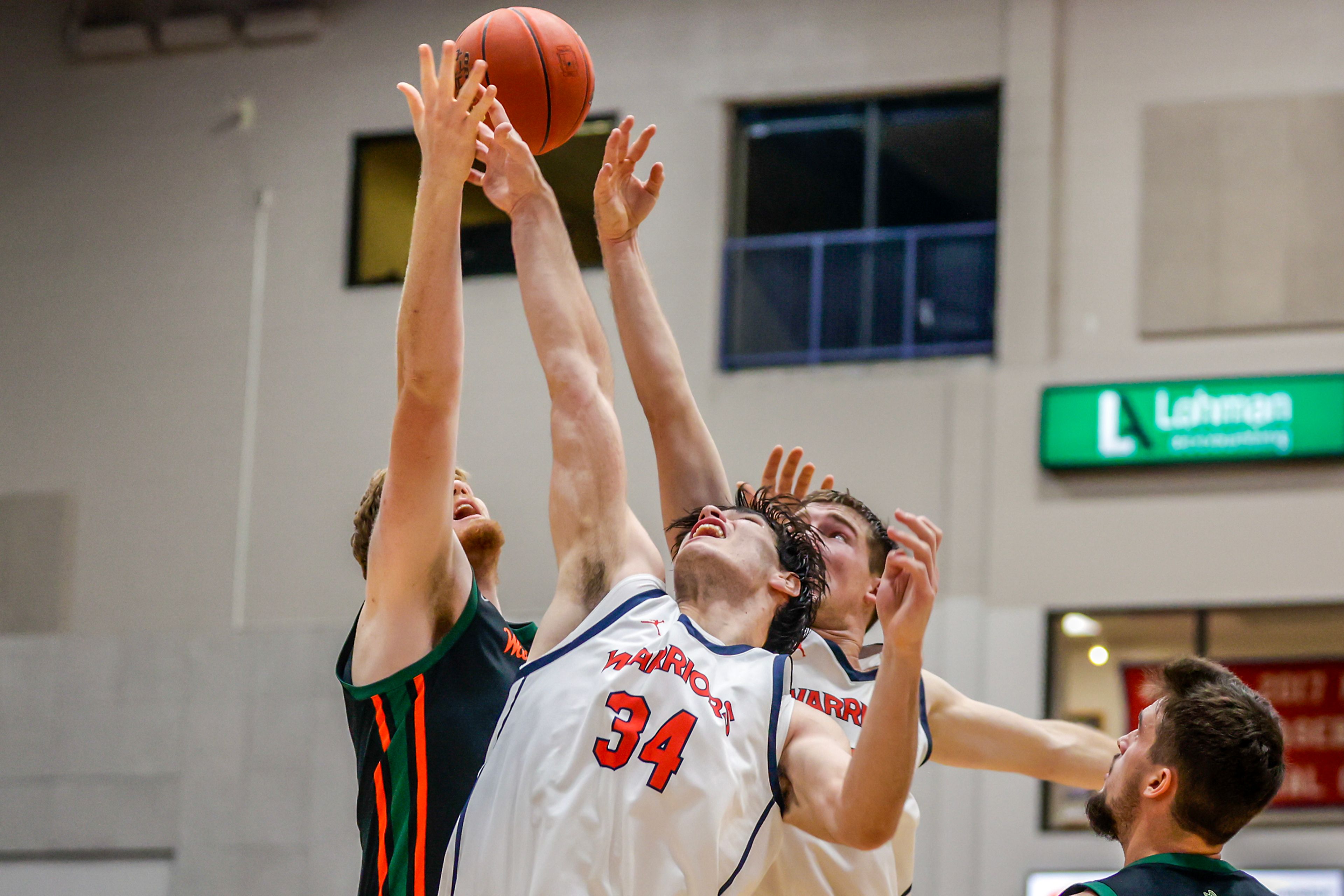 Lewis-Clark State forward Josh Salguero competes for a rebound with Walla Walla center Soren Dalan during a quarter of a Cascade Conference game Tuesday at Lewis-Clark State College in Lewiston.