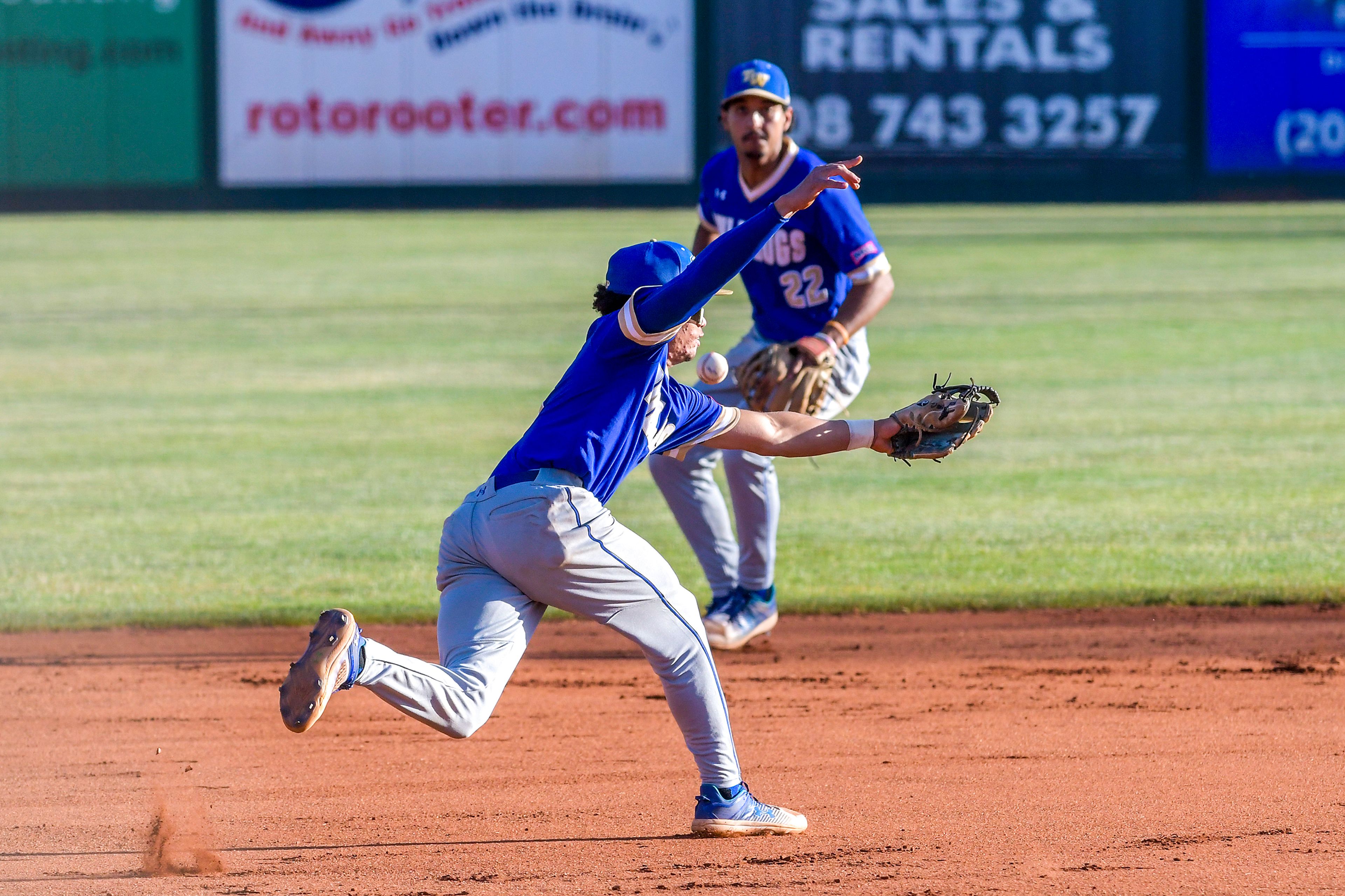 Tennessee Wesleyan third baseman Dante Leach misses a catch picked up by shortstop Marco Martinez against Hope International in Game 19 of the NAIA World Series at Harris Field Friday in Lewiston.