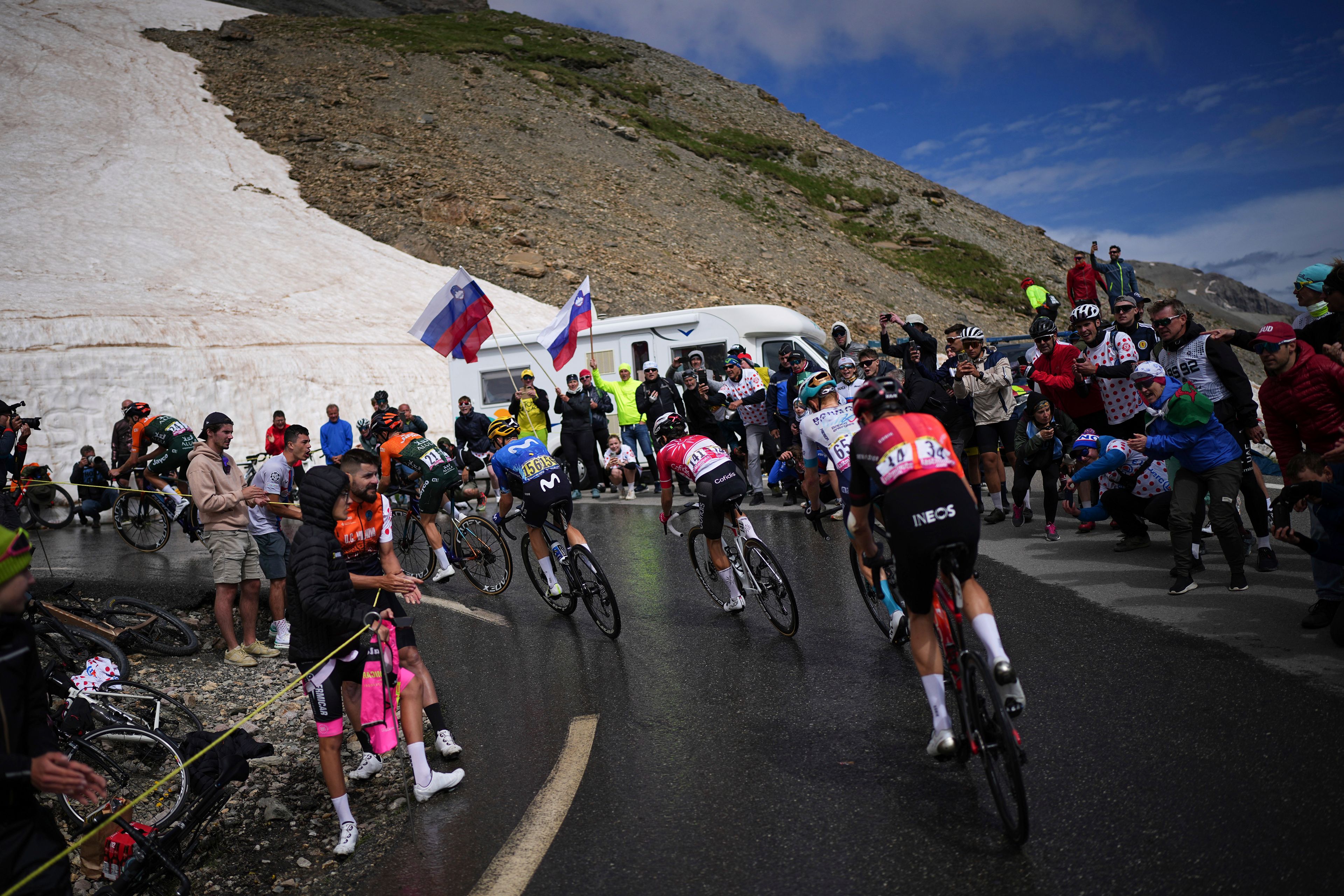 Riders ride to climb the Col du Galibier during the fourth stage of the Tour de France cycling race over 139.6 kilometers (86.7 miles) with start in Pinerolo, Italy and finish in Valloire, France, Tuesday, July 2, 2024. (AP Photo/Daniel Cole)