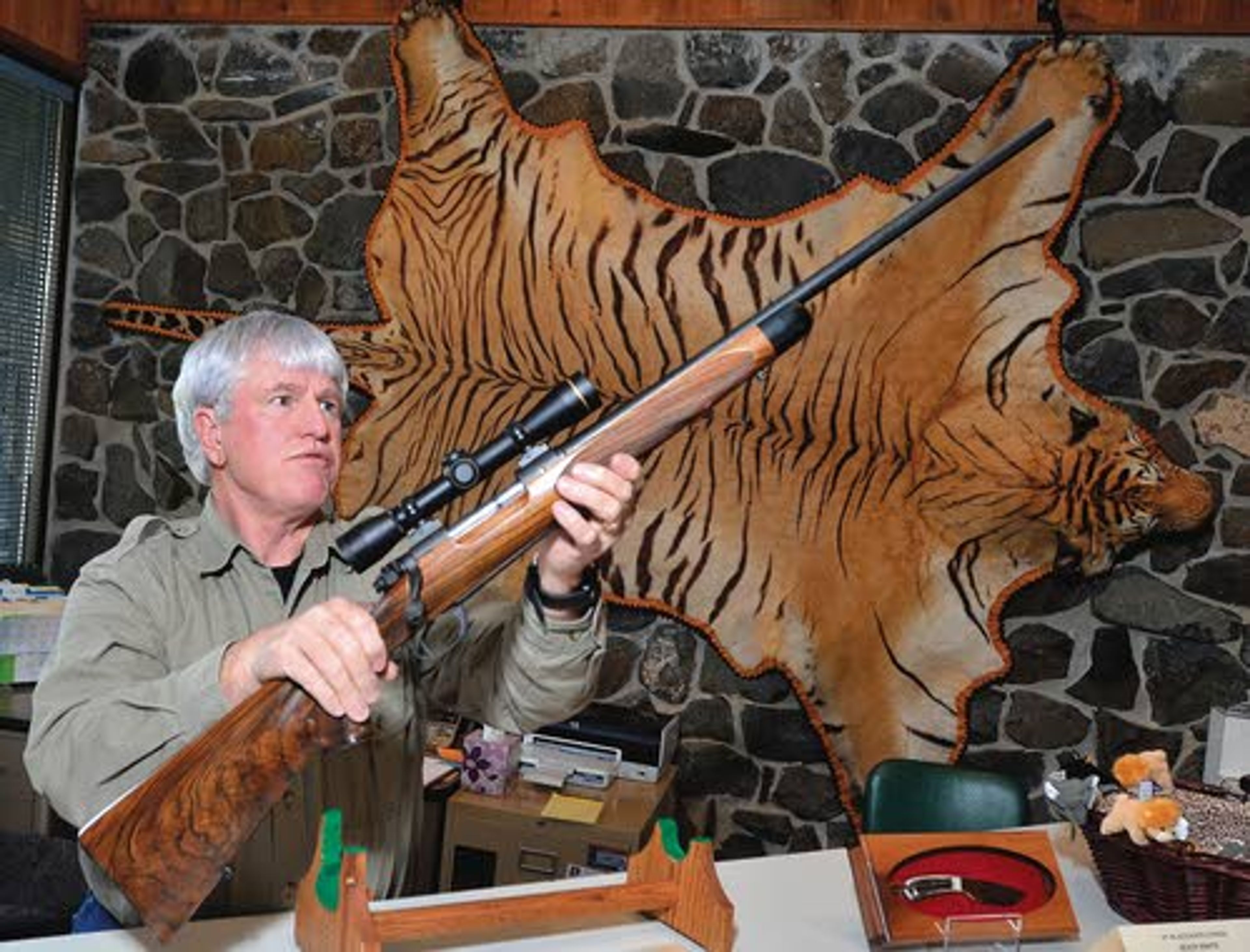 Mike Butler, director of the Jack O’Conner Hunting Heritage Education Center, shows the Jack O’Conner commemorative Winchester .270 rifle.