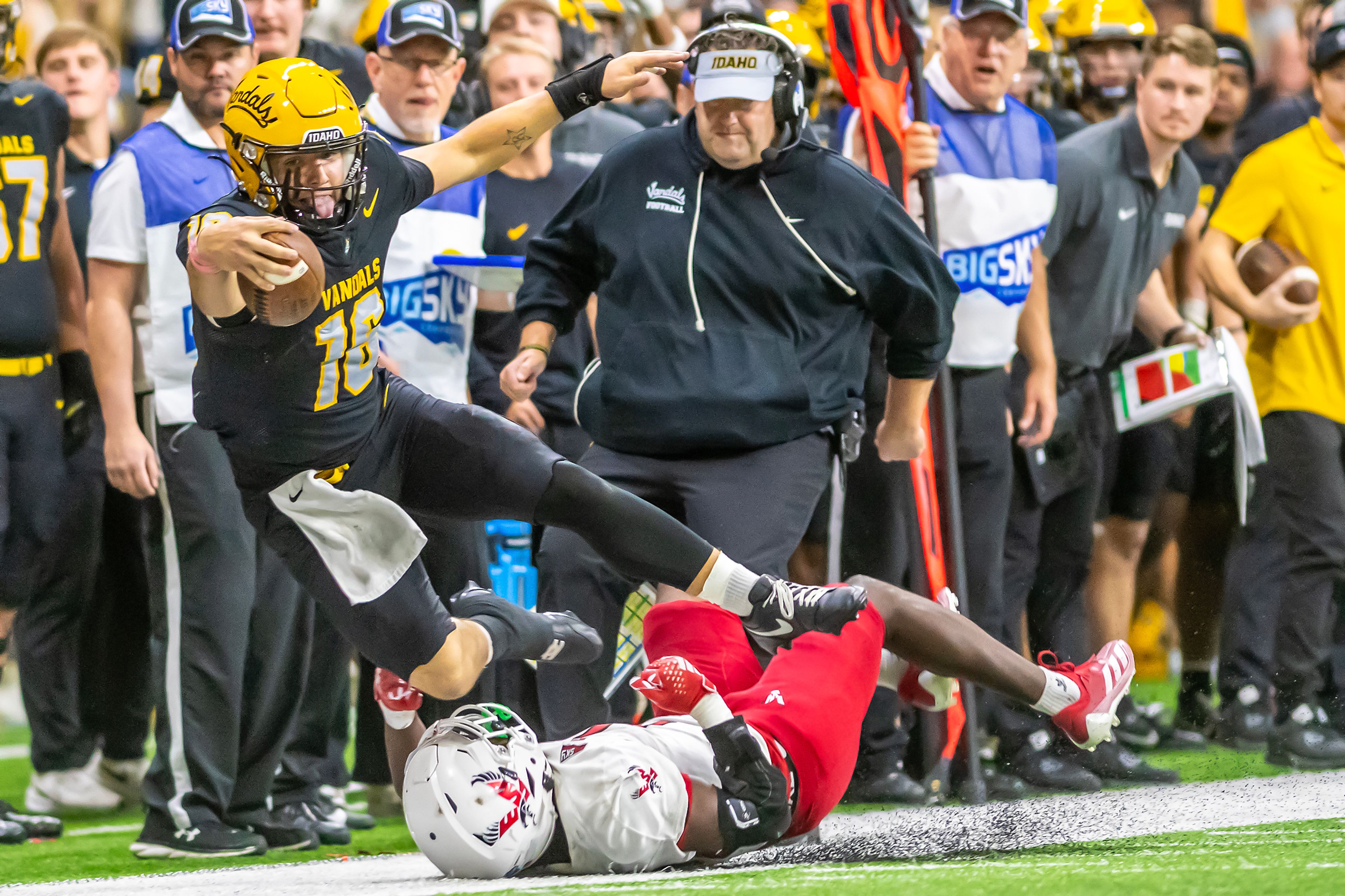 Idaho quarterback Rocco Koch is tackled out of bounds by Eastern Washington during a Big Sky game Saturday at the Kibbie Dome in Moscow. ,