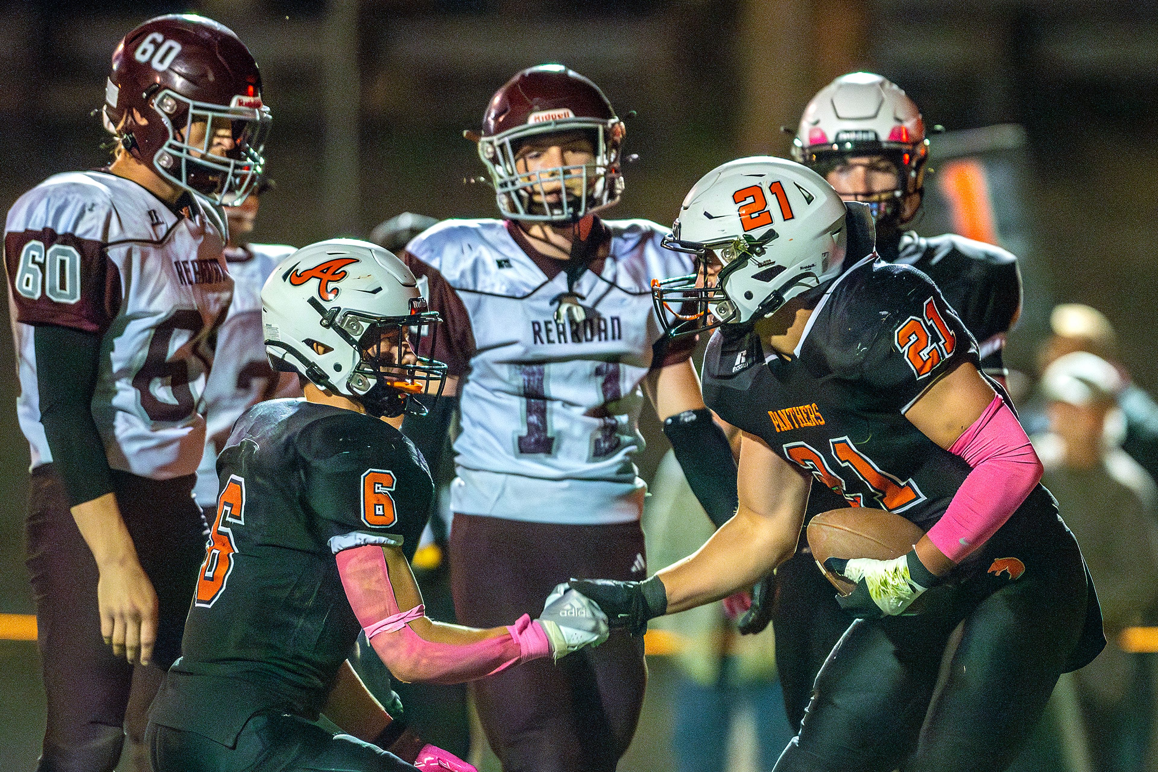 Asotin running back Colt Kelley (21) celebrates a touchdown with Peter Eggleston against Reardan during a Northeast 2B League game Friday in Asotin.,