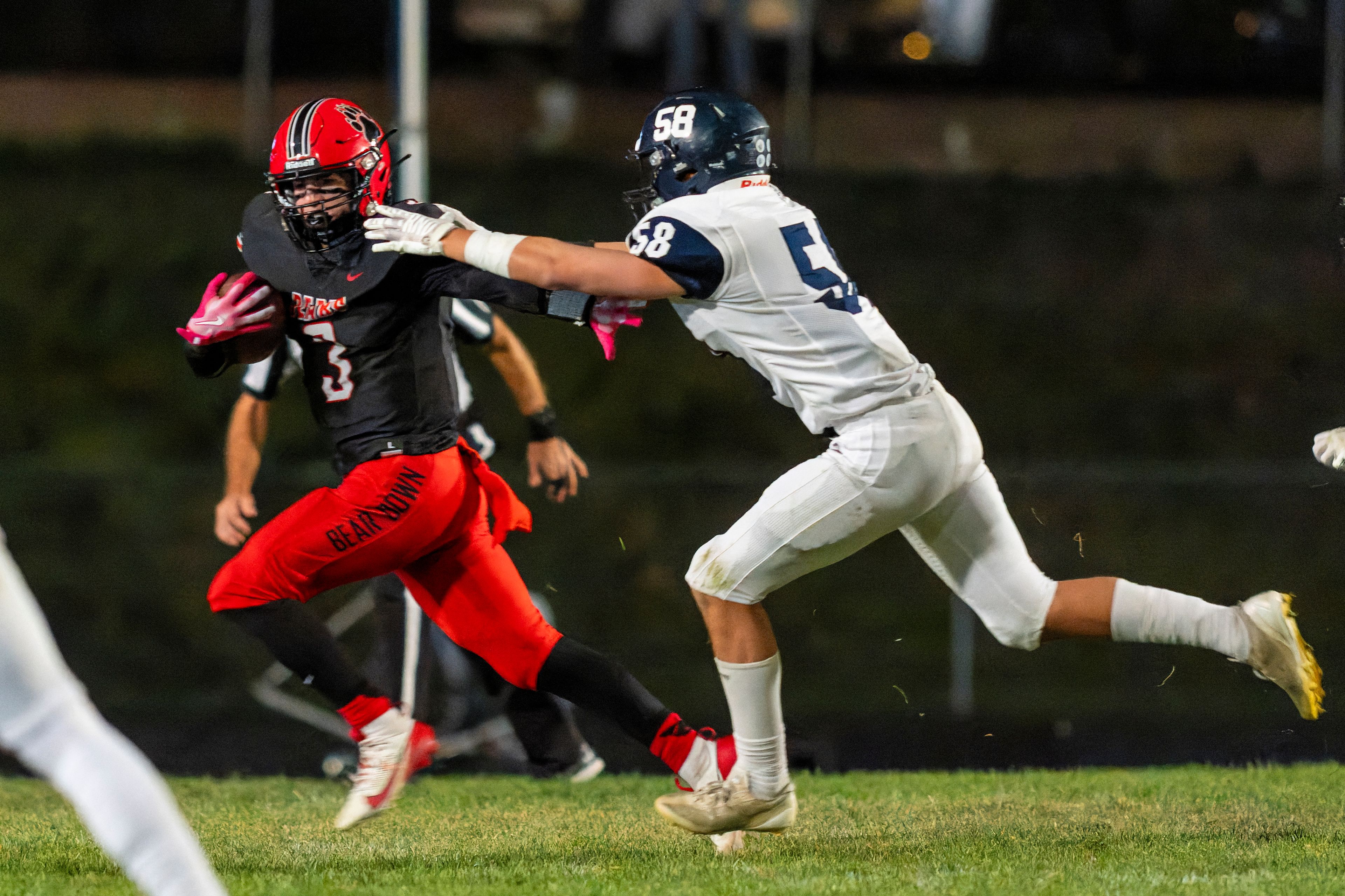 Moscow running back Tyson Izzo (3) runs the ball during a game against the Bonners Ferry Badgers on Friday night at Bear Field in Moscow.