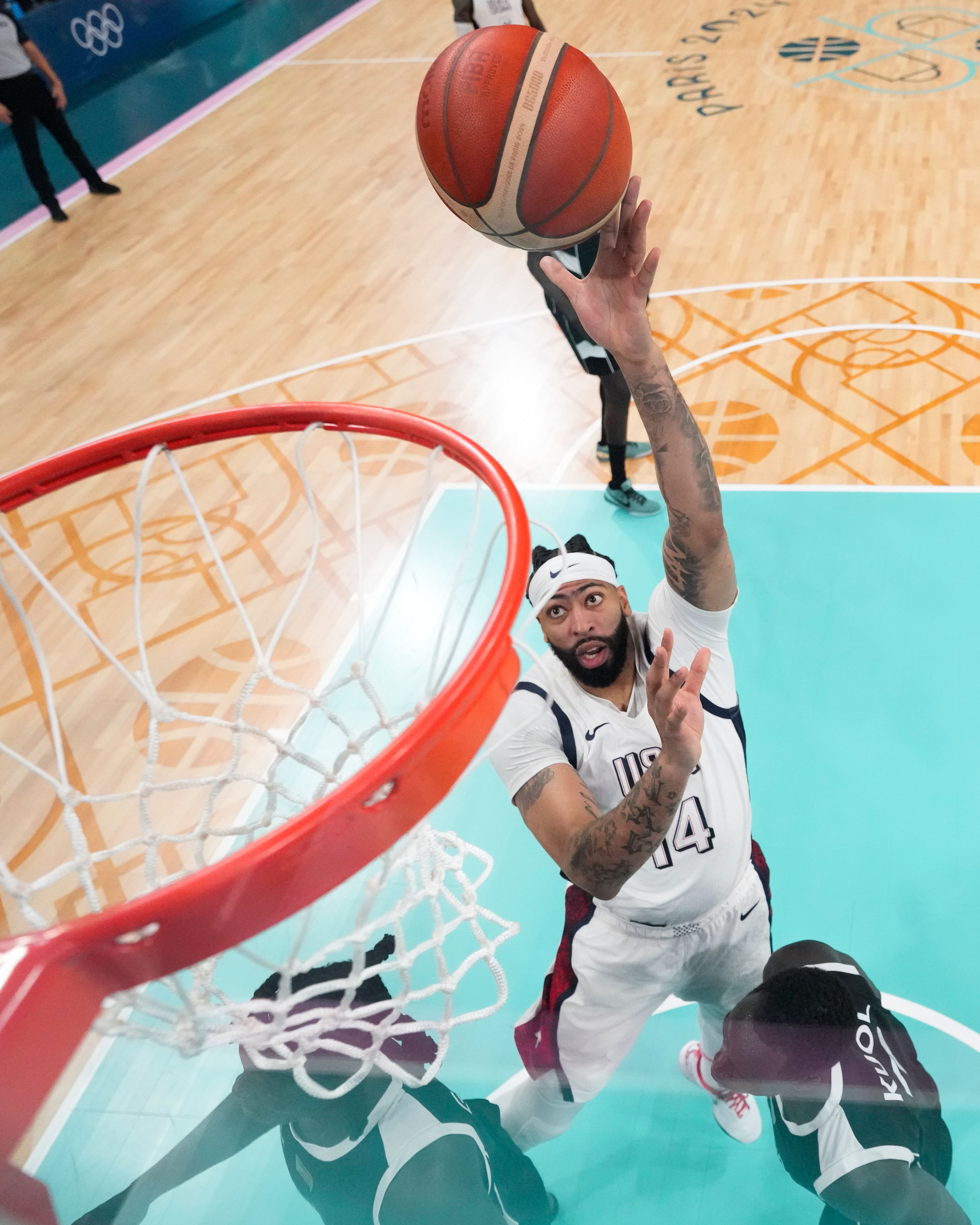 Anthony Davis, of the United States, shoots over Carlik Jones, of South Sudan, in a men's basketball game at the 2024 Summer Olympics, Wednesday, July 31, 2024, in Villeneuve-d'Ascq, France. (AP Photo/Mark J. Terrill, Pool)