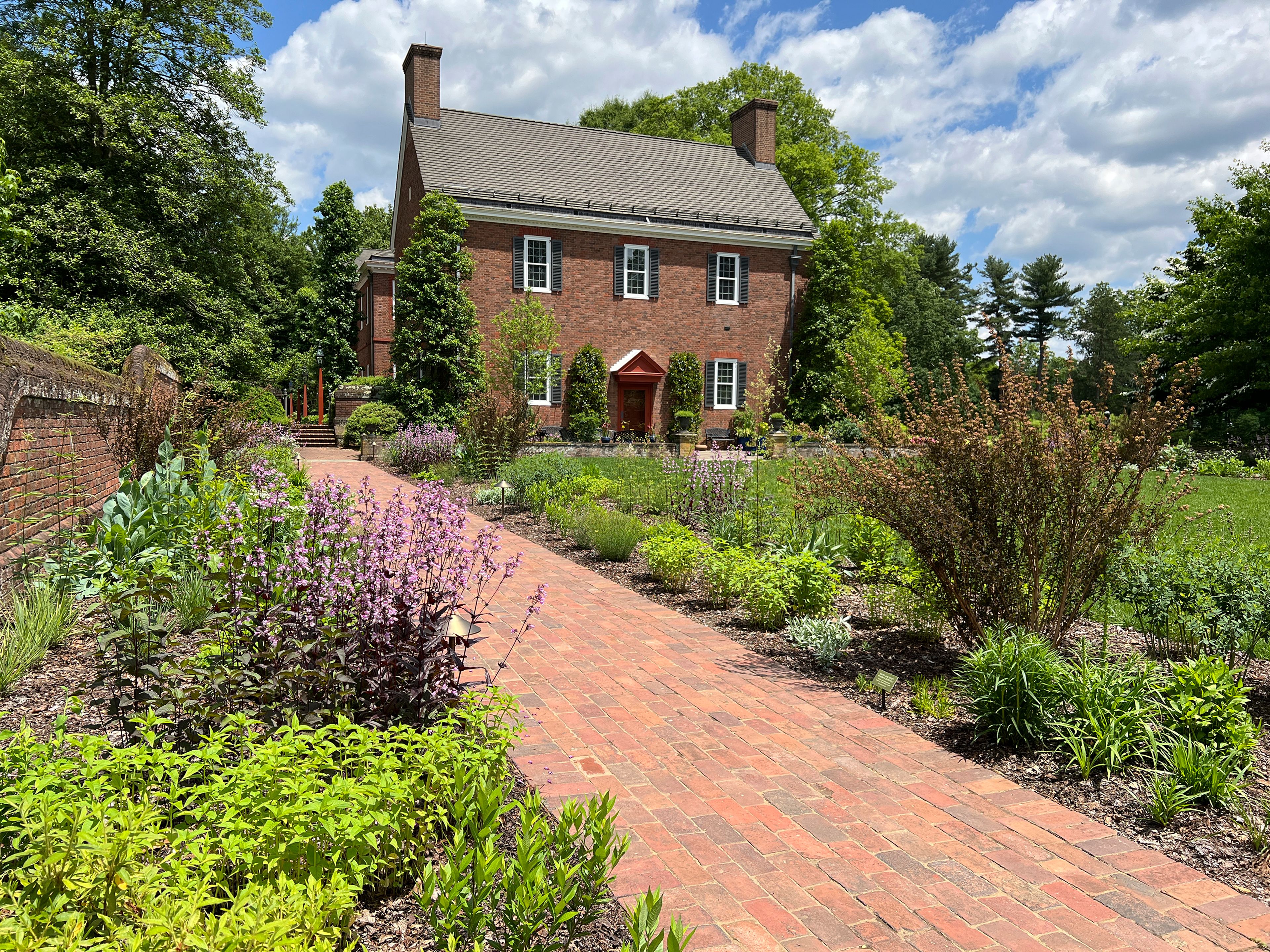 This undated photo provided by Mt. Cuba Center shows the Hockessin, Del. botanical garden's formal South Garden, planted entirely with native plants and cultivars of native plants, including: Penstemon, Thalictrum, Tradescantia, Liatris, Monarda, Amsonia, Artemesia, Baptisia, Eryngium, Physocarpus, Redbeckia, Solidago and Eryngium species.