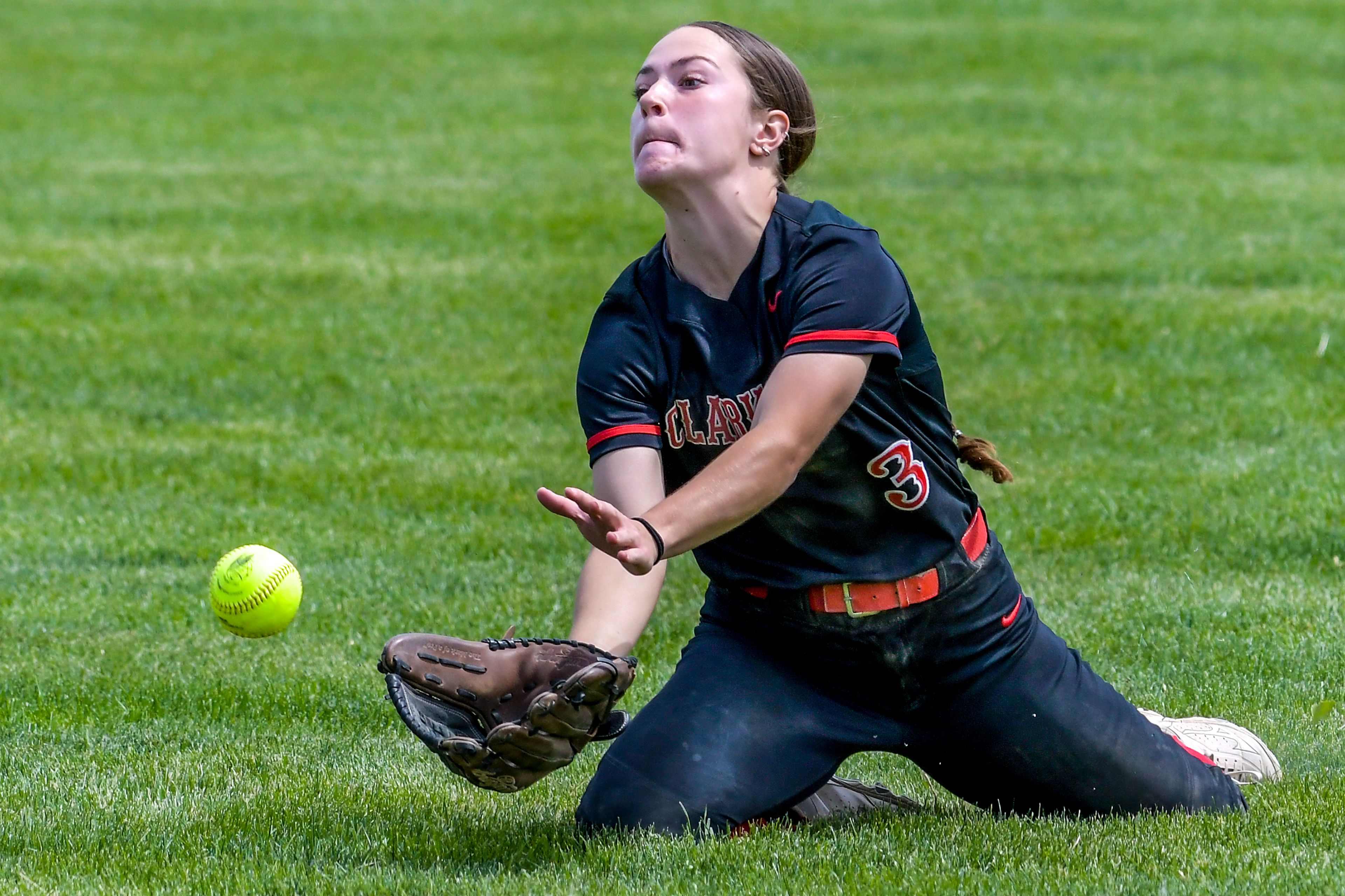 Clarkston center fielder Leah Copeland dives after a ball on a hit from Shadle Park during an inning of the District Championship Game Saturday in Clarkston.